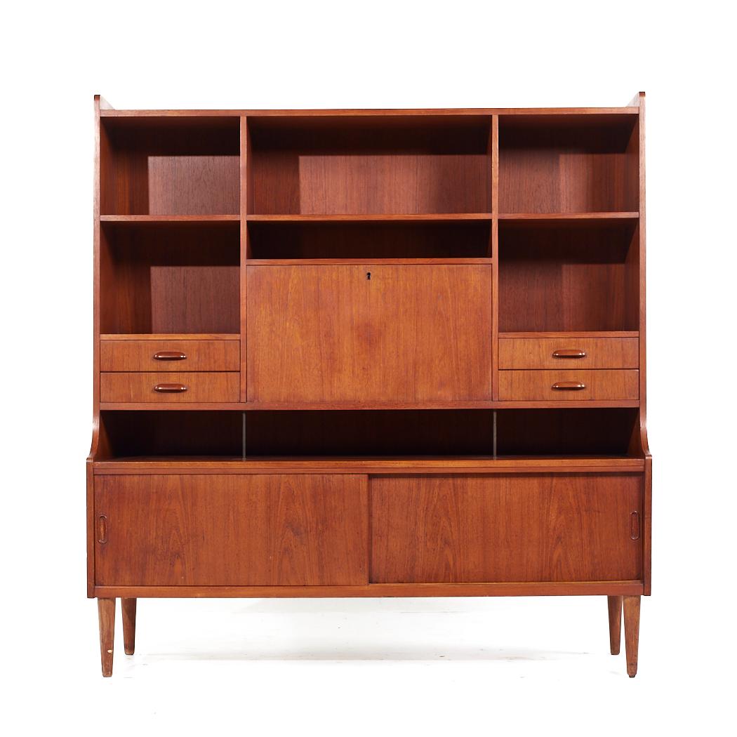 Westnofa Style Mid Century Danish Teak Hutch

This hutch measures: 60 wide x 18.25 deep x 63.25 inches high

All pieces of furniture can be had in what we call restored vintage condition. That means the piece is restored upon purchase so it’s free