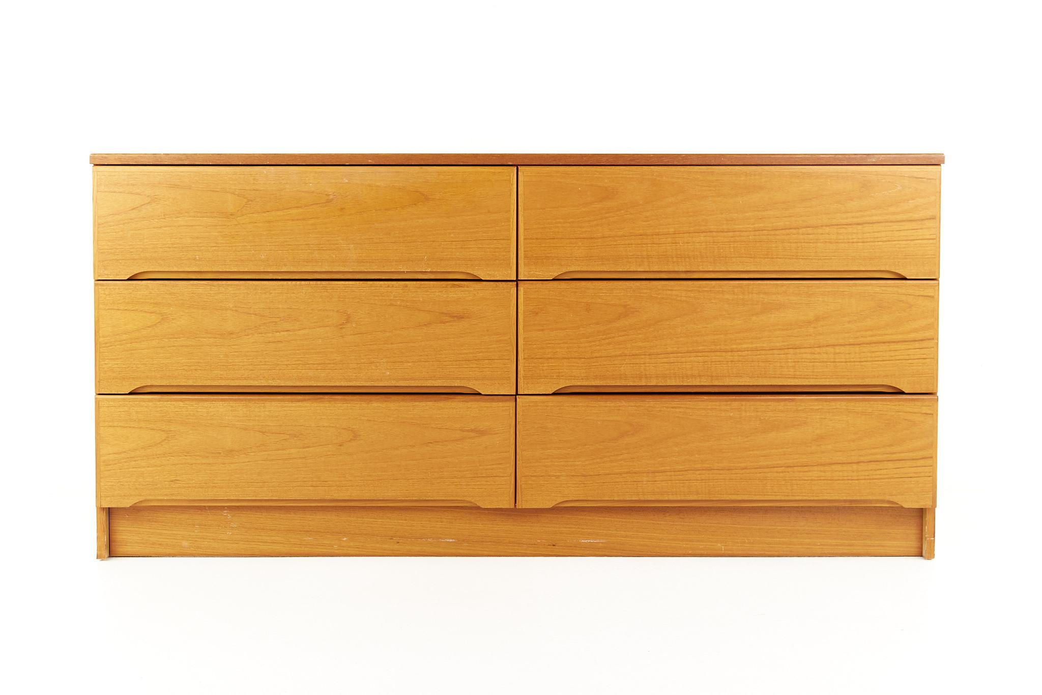 Westnofa style mid century teak 6 drawer lowboy dresser

This dresser measures: 60 wide x 18 deep x 29 inches high

All pieces of furniture can be had in what we call restored vintage condition. That means the piece is restored upon purchase so