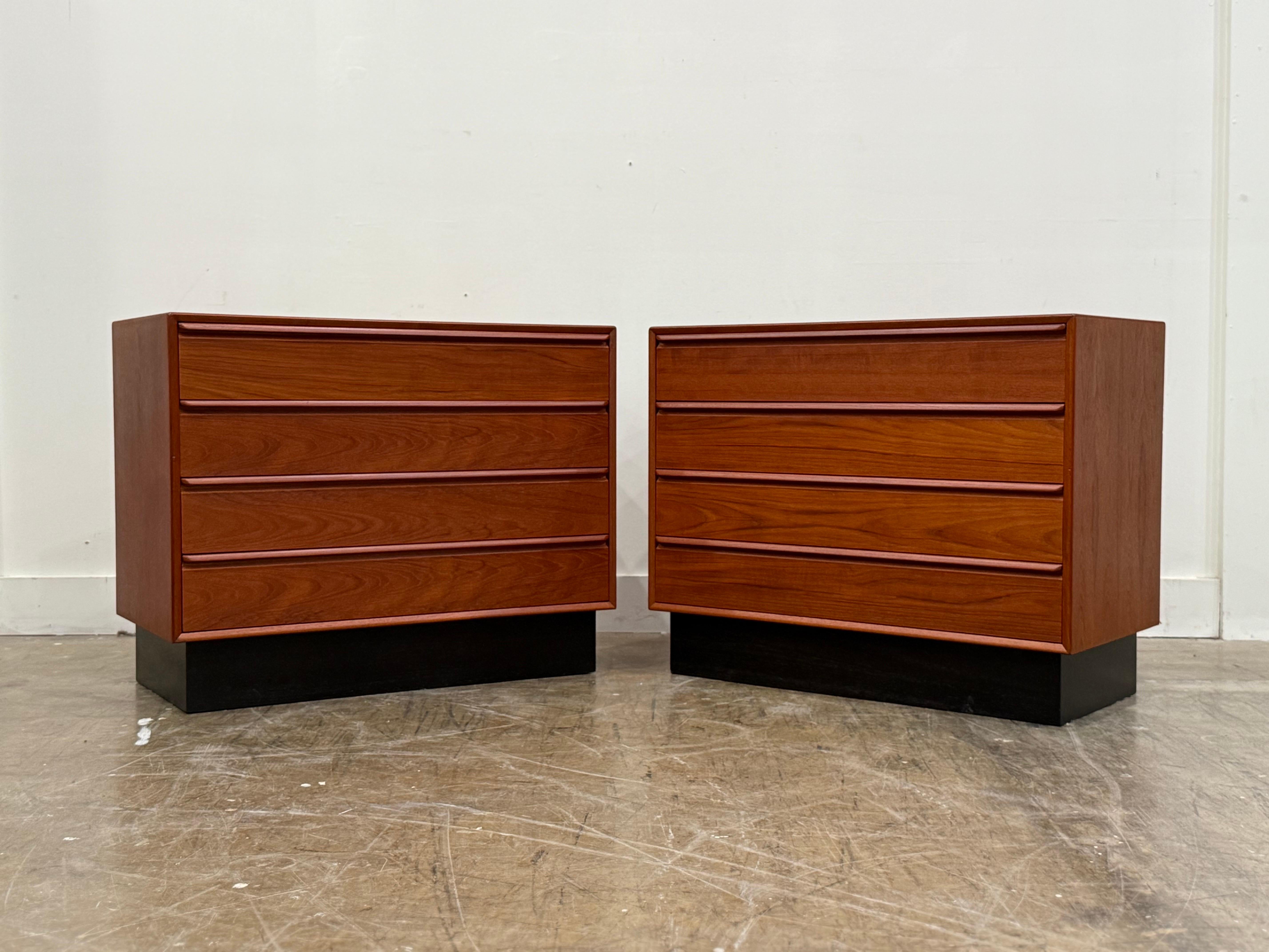 PAIR of vintage midcentury Scandinavian modern 4 drawer chests by Westnofa, circa 1970s. Gorgeous old growth teak cases and drawers with black plinth bases. 
Fully restored by our team and in excellent, ready to use condition. No flaws of note.