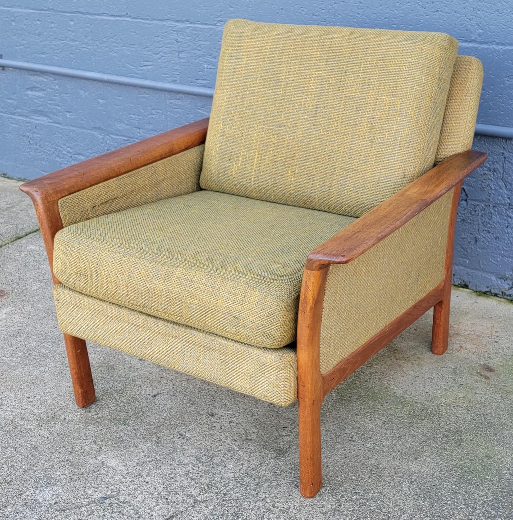 A teak Danish Modern lounge or side chair made by Westnofa of Norway. Circa. 1960's. Solid teak frame featuring sculptural curved arms. Structurally very solid and very comfortable. Retains original finish and upholstery. Condition satisfactory for