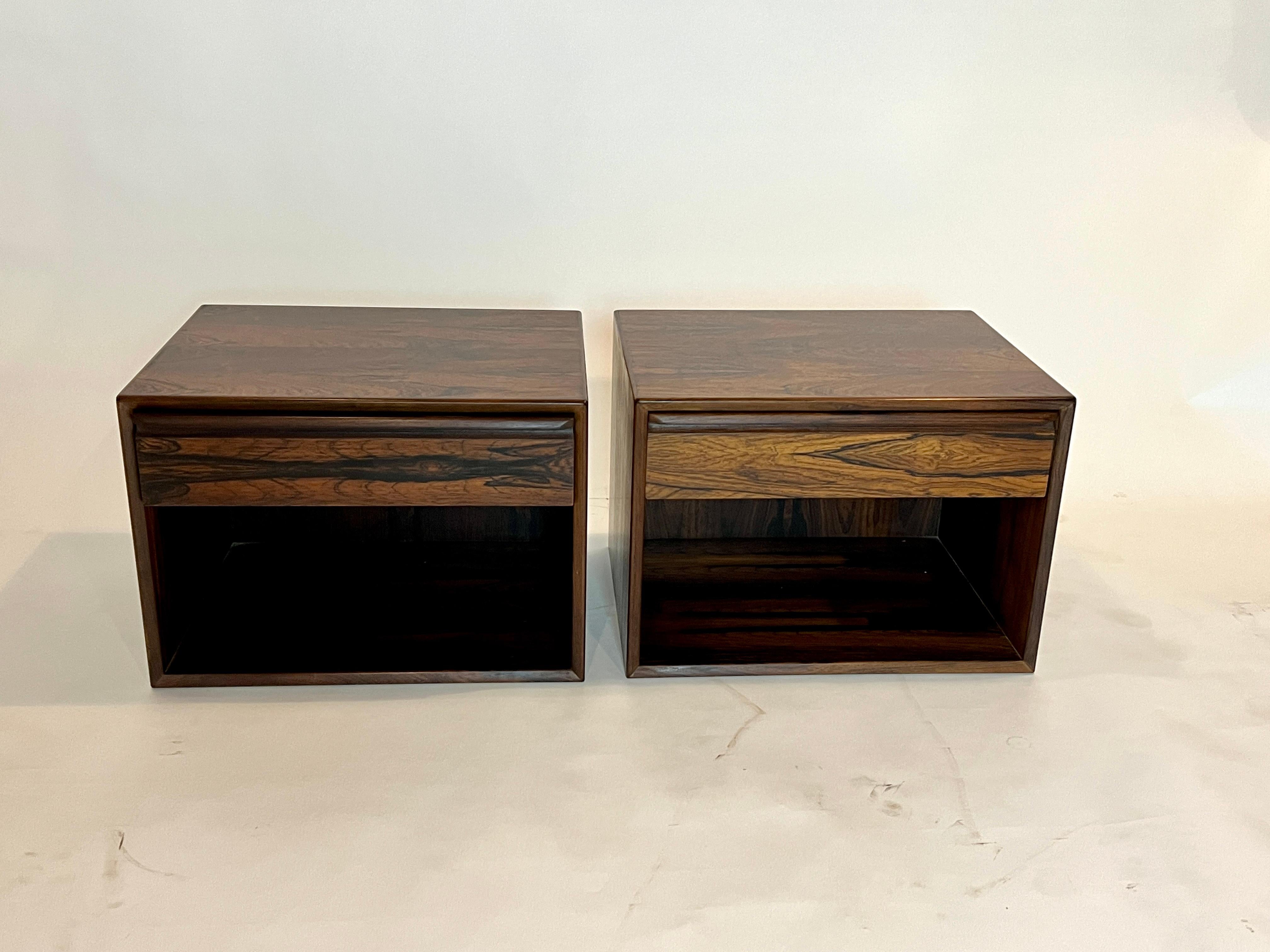 Pair of rosewood wall mount nightstands by Westnofa, Norway 1960's. Each cabinet is crafted of rosewood inside and out with one pull out drawer and an open cabinet for storage. These cabinets can sit on the floor to accommodate a low platform bed or