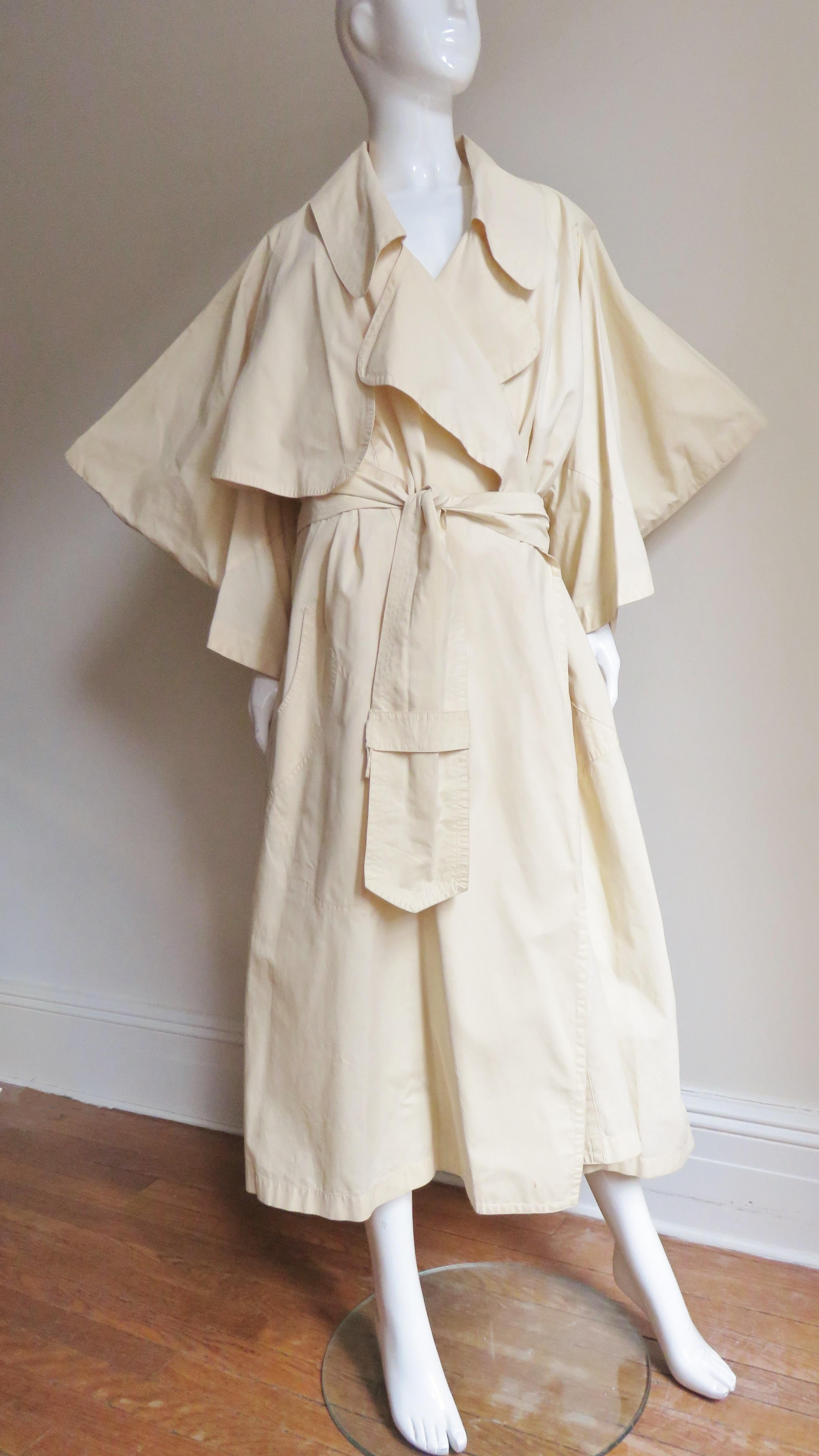 An incredible oversized pale yellow cotton trench coat from the final collaboration of Vivienne Westwood and Malcolm McLaren, the A/W 1983-1984 Worlds End Witches Collection which has been the subject of museum exhibitions. The coat features rounded