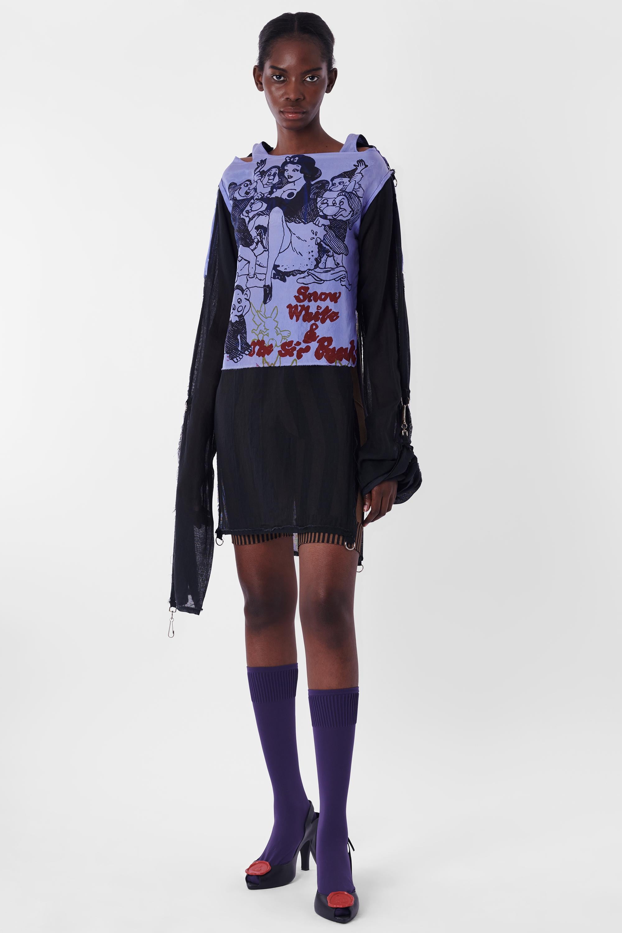 Vivienne Westwood Malcom McLaren Late 1970's Seditionaries Snow White Bondage Shirt. Features iconic cutout shoulders, long sleeves with metal hoops and clasps, double layer and slit along two sides. In excellent vintage condition.
Brand: