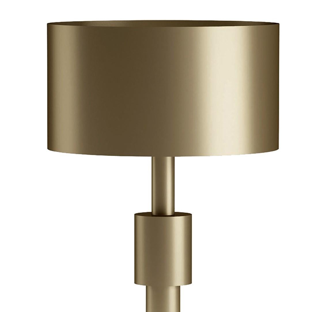With a silhouette that evokes the collapsible telescopes of the old-time voyagers, the vertical design of this eye-catching table lamp brings a dynamic accent to a console display or desk table. Entirely crafted of brass with a burnished finish, it