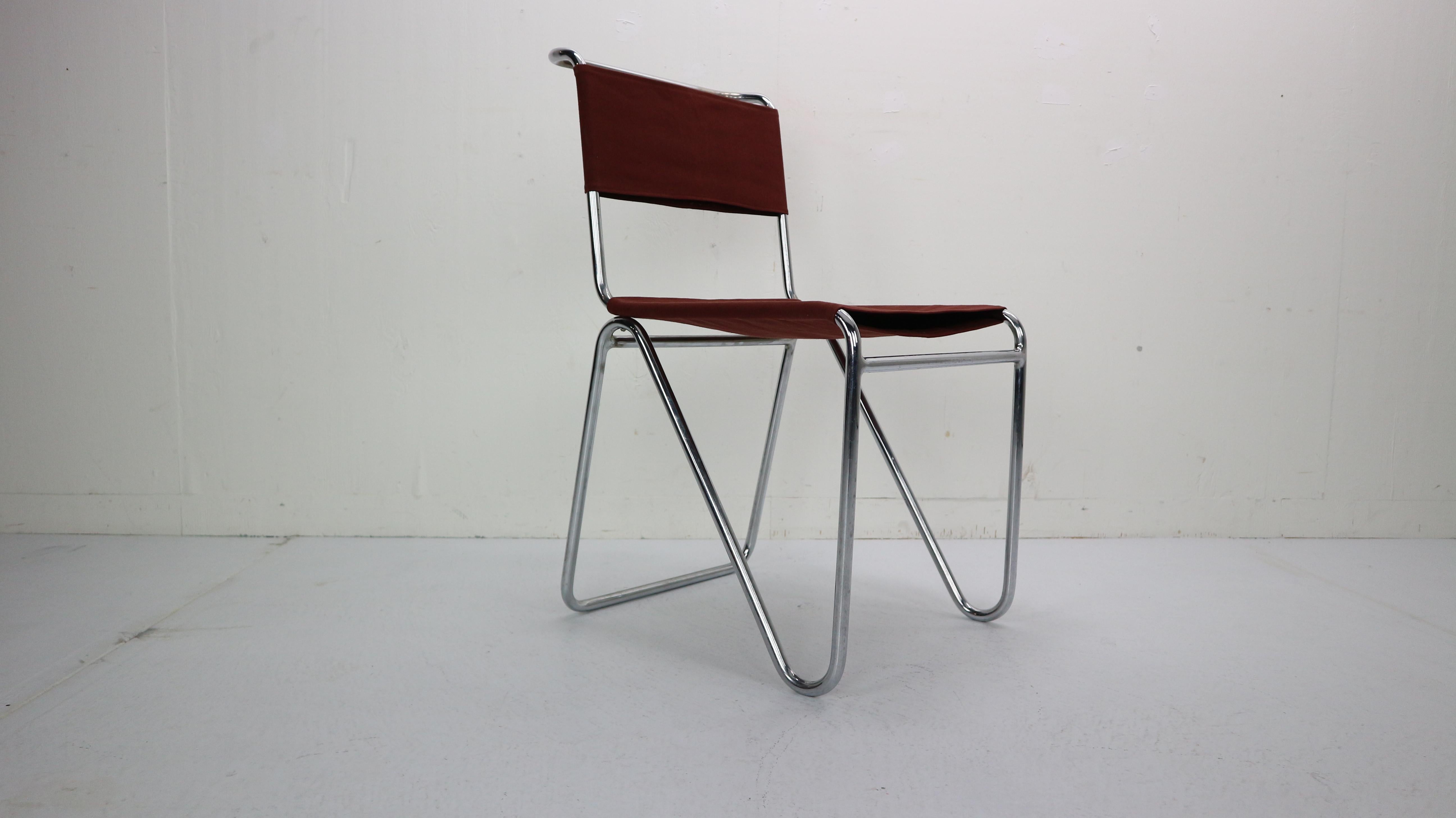 Minimalistic Dutch design chair designed by W.H. Gispen for Gispen Culemborg manufactured in 1930s, Netherlands.
Model number- 102.
Tubular curved chrome base with newly upholstered dark red canvas fabric.

