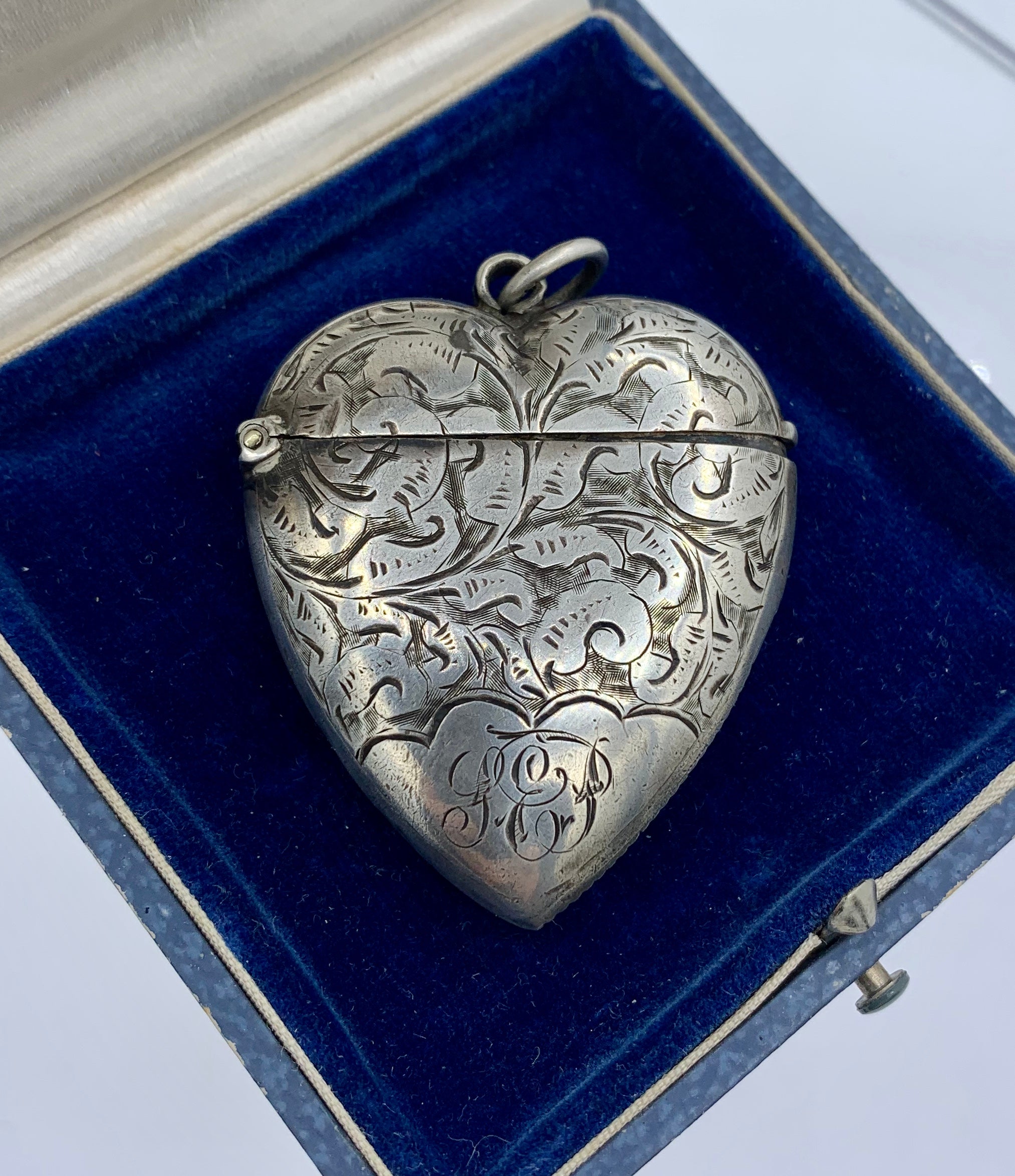 THIS IS A WONDERFUL ANTIQUE VICTORIAN HEART SHAPE LOCKET, MATCH HOLDER STRIKER OR PERFUME VINAIGRETTE BY THE ESTEEMED BRITISH SILVERSMITH WILLIAM HAIR HASELER.   HASELER WAS FAMED FOR PARTNERING WITH LIBERTY & CO. OF LONDON AND PRODUCING THE WORKS