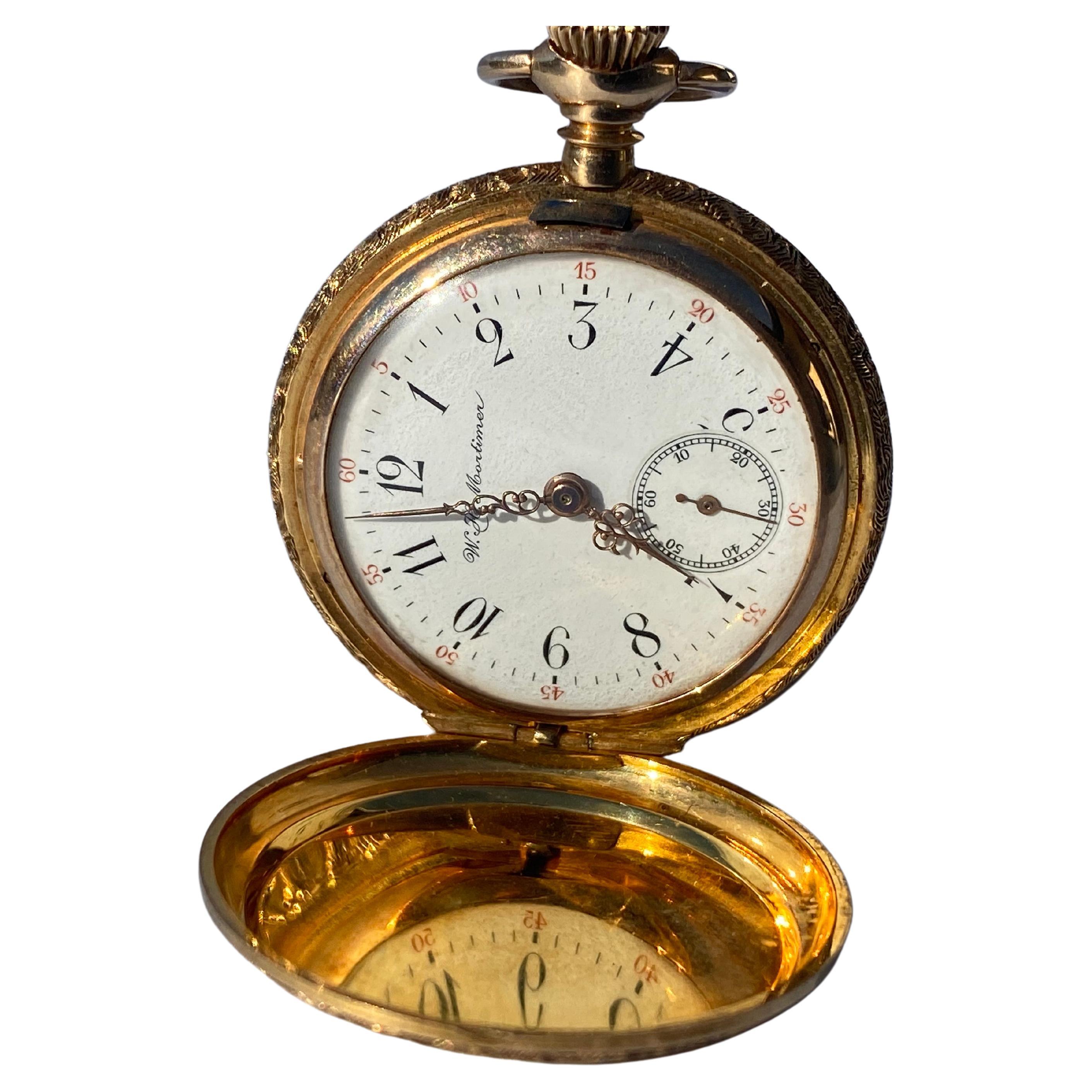 W.H. Mortimer Co. 33 mm in diameter
Inside Movement Case no. 1672137

14 karat pocket watch is Circa 1900's and is in working condition.
Small second-hand reader at 6:00
Porcelain white dial with black numbers. Red second-hand indicators at the