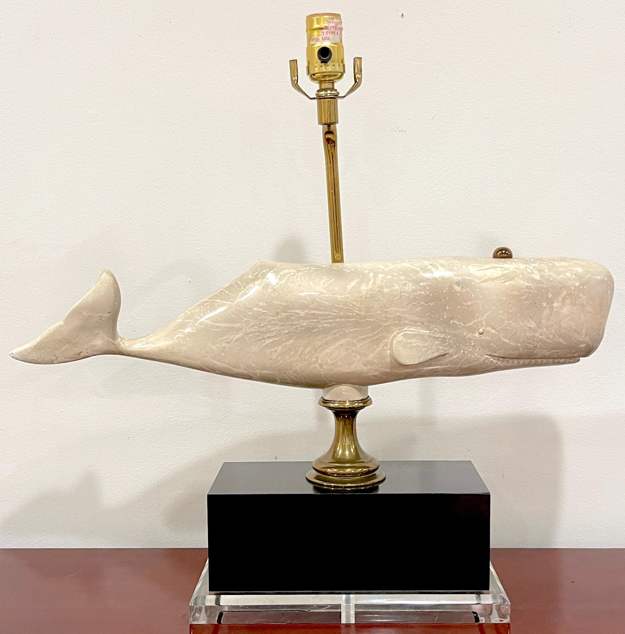 Mid Century Marine Figural Whale Lamp, Bauer Lamp Co, 1991
A captivating blend of artistry and functionality. Its realistic and sizeable 23-inch wide whale sculpture is realistically cast, expertly decorated  with off-white enamel decoration,