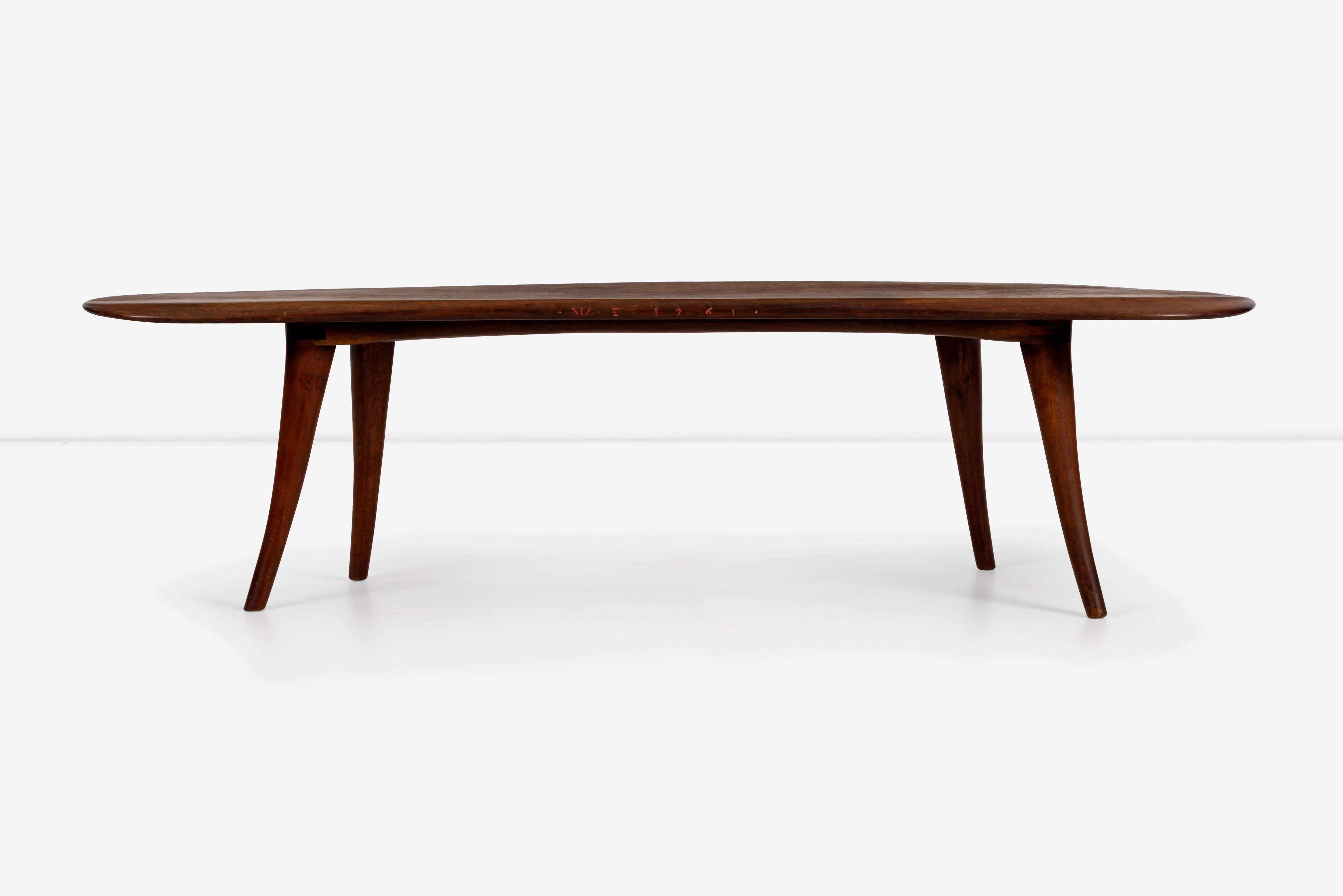 Wharton Esherick large sculpted walnut coffee table, one inch thick solid walnut slab hand carved with tapered edges, solid tapered splayed legs.
Signed and dated: 