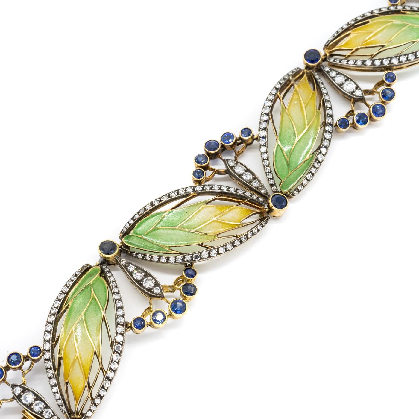 A Moira wheat and seed heads plique à jour enamel, sapphire and diamond bracelet, with ears of wheat in yellow to green plique à jour enamel, with navette shaped eight-cut diamond set surround, alternating with sapphire and eight-cut diamond set