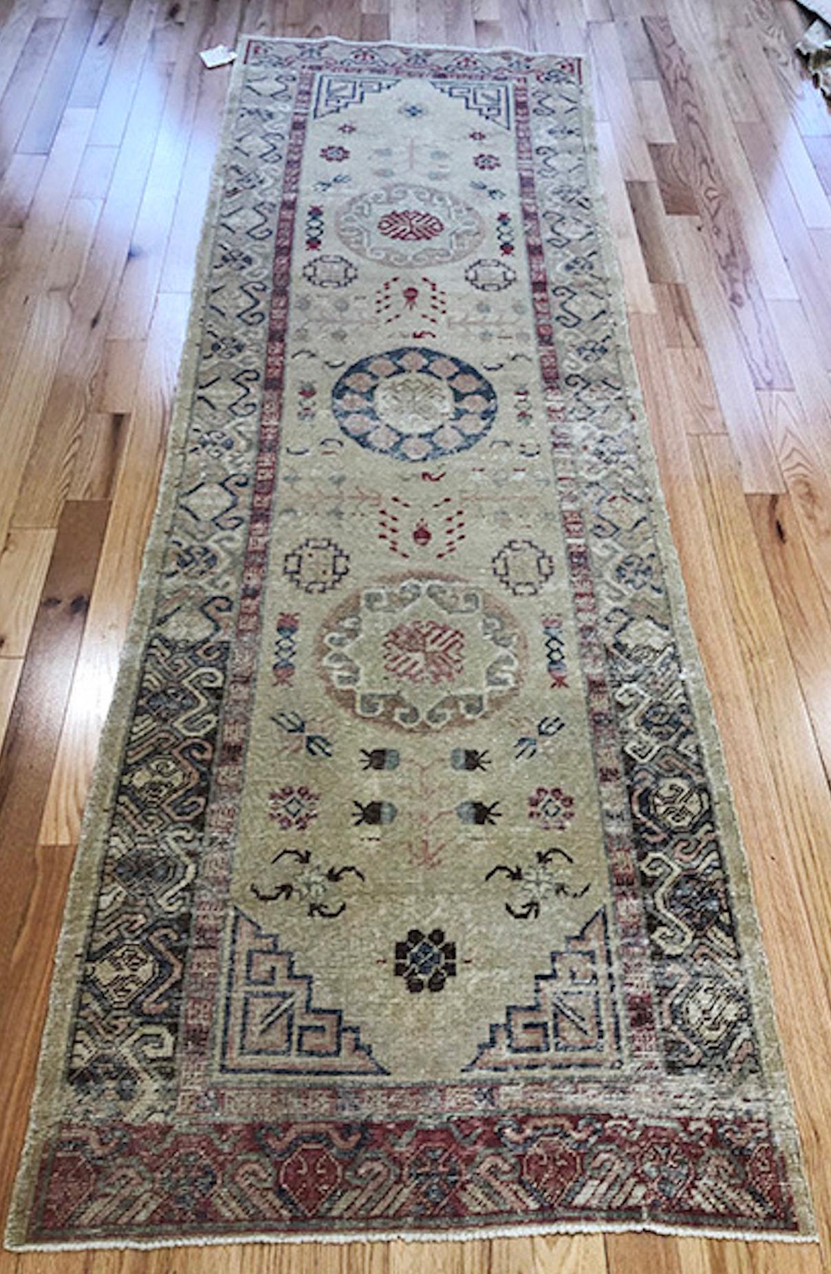 Orgin: Mongolia
Dimensions: 10' x 3’4?
Age: 1920’s
Design: Khotan
Material: 100% Wool-pile
Color: Wheat, Rust, Navy Blue, Beige

7134

An epitome of history, character and culture, Antique Khotan rugs add richness to a room. Produced in