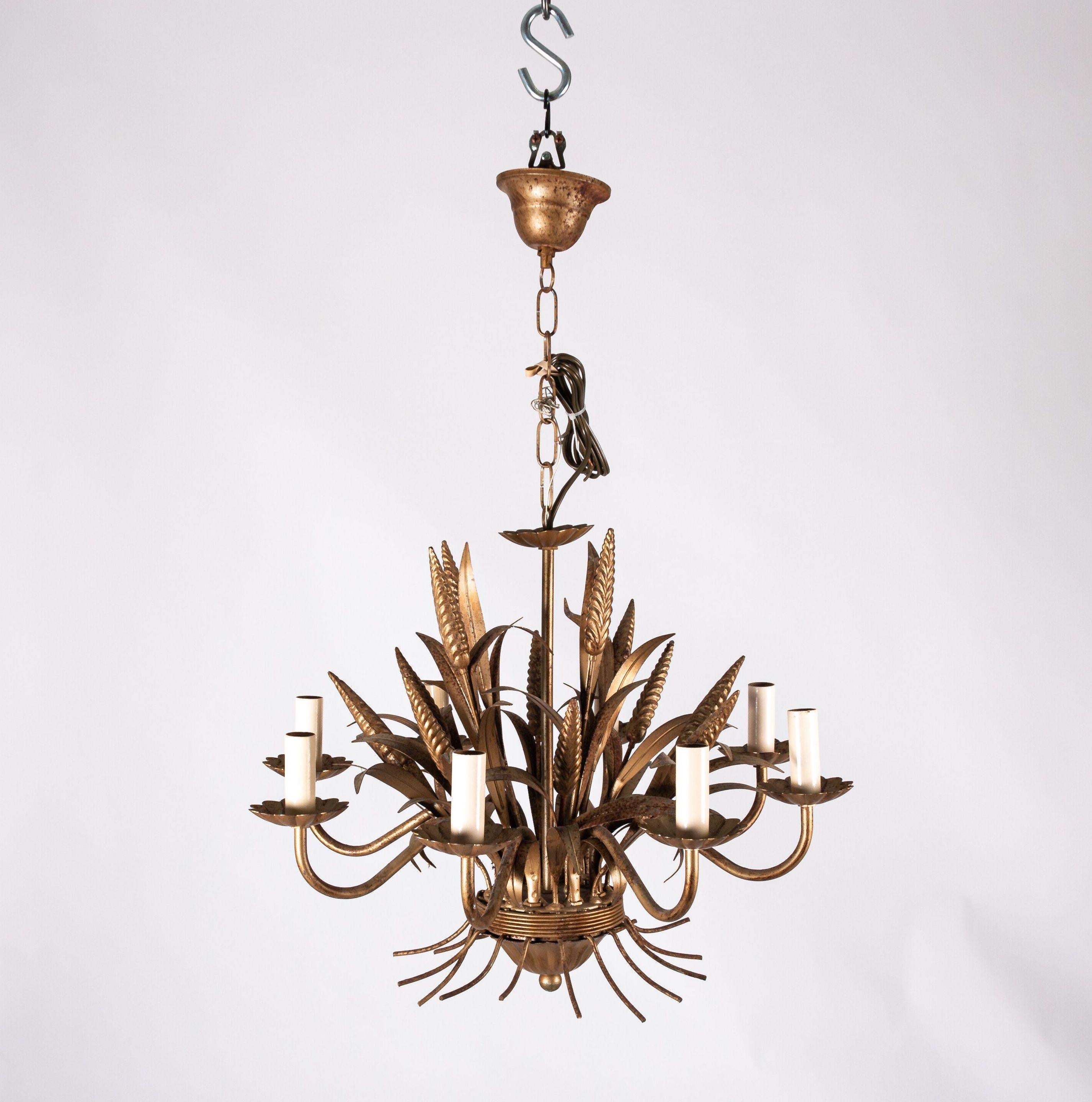 Wheat sheaf chandelier in gilded tole, circa 20th century. The piece has been recently wired and repaired with shades not included. Please note of wear consistent with age.