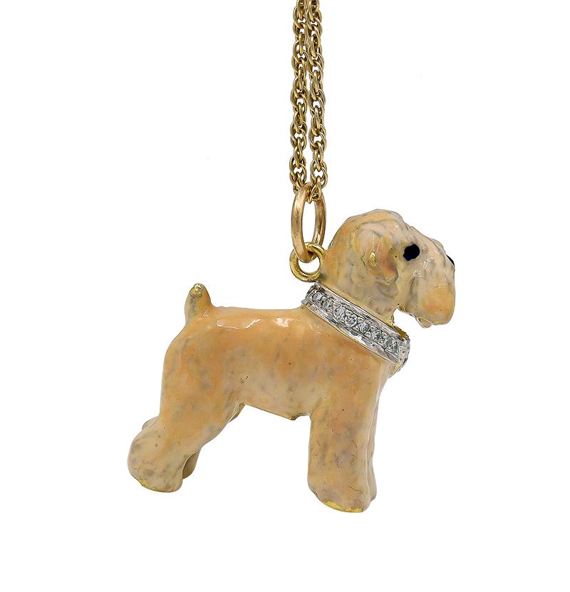 Fabulous charm/pendant:  a figural wheaten terrier.  Shaded cream-colored enamel, with bright black enamel eyes and a red enamel tongue.  Wearing a collar encrusted with diamonds, with a diamond heart in the center.  Very heavy gauge 18K yellow