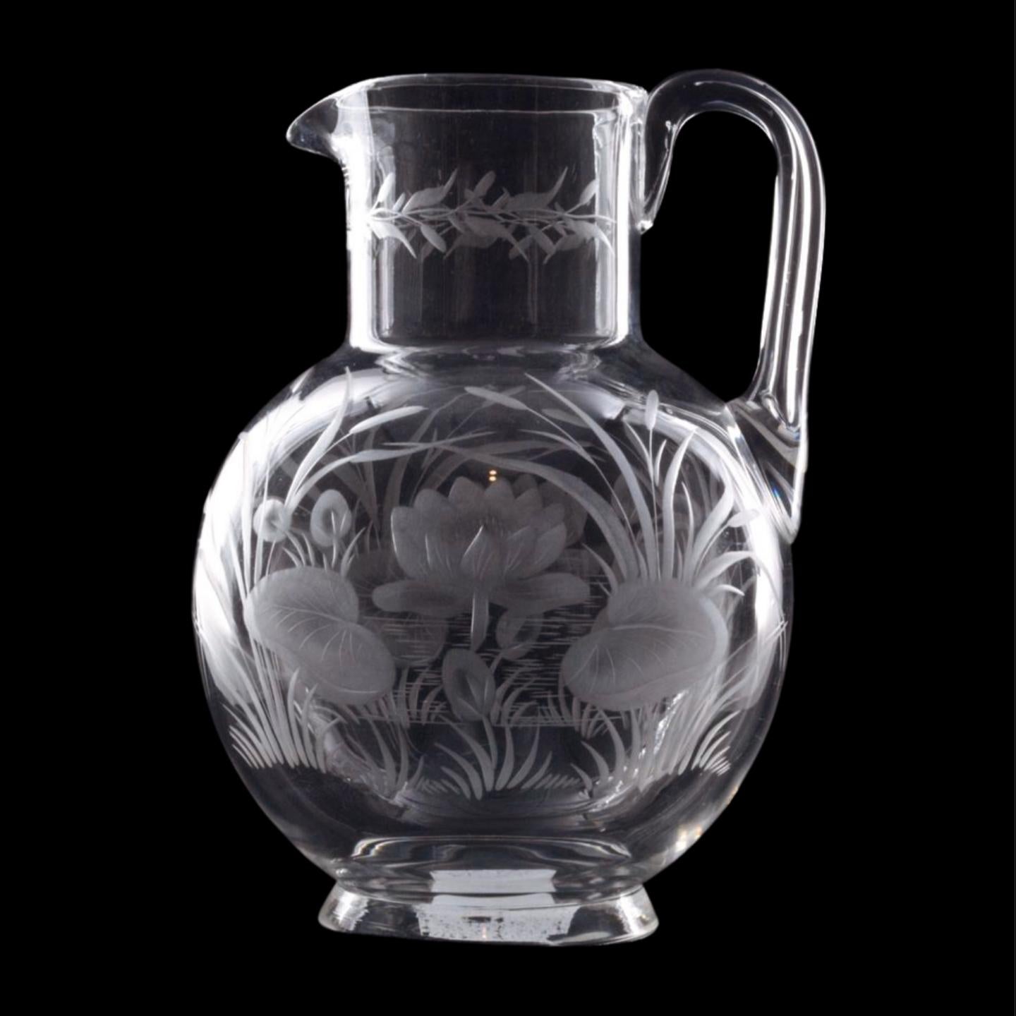 A lovely water jug with spherical body, suitably etched and engraved with water lillies and other aquatic plants.

Stourbridge glass refers to glassware produced in the town of Stourbridge, located in the West Midlands region of England. Stourbridge