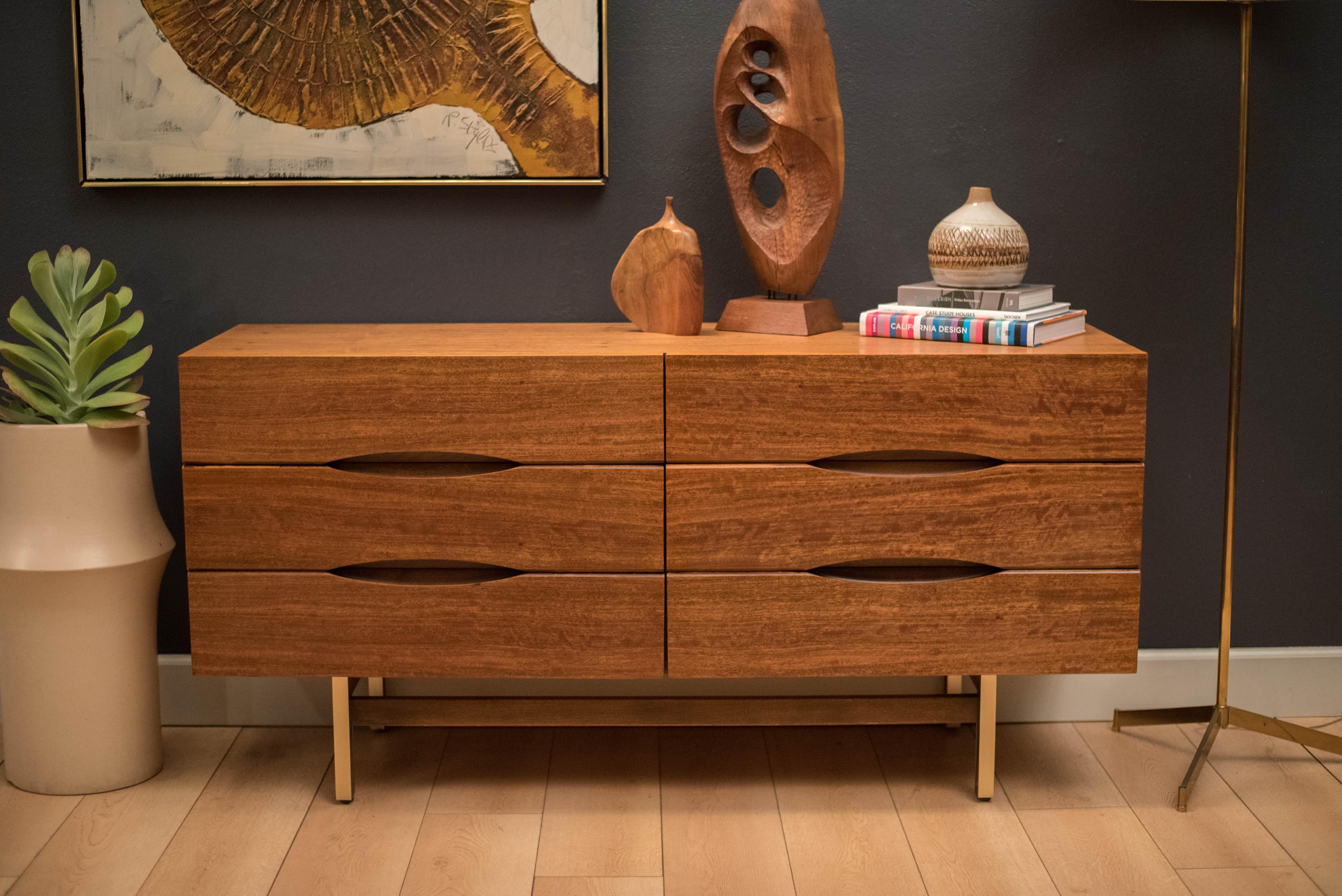 Vintage double dresser manufactured by American of Martinsville in mahogany. This piece includes six storage drawers with sculpted eye pulls and brass accents.