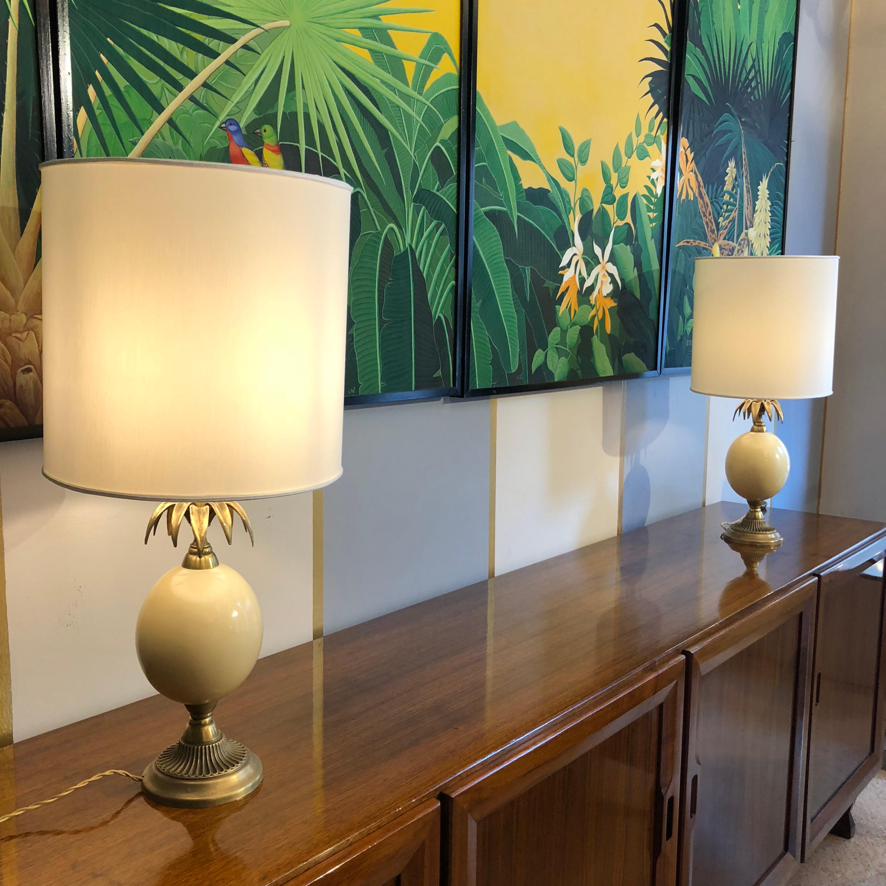 With dark golden brass base and leaves, spheric resin ivory color central body these tables lamps are very decorative and elegant items. We have restored the electric systems and rewired them for Italy use ( on request we can adapt it for any other