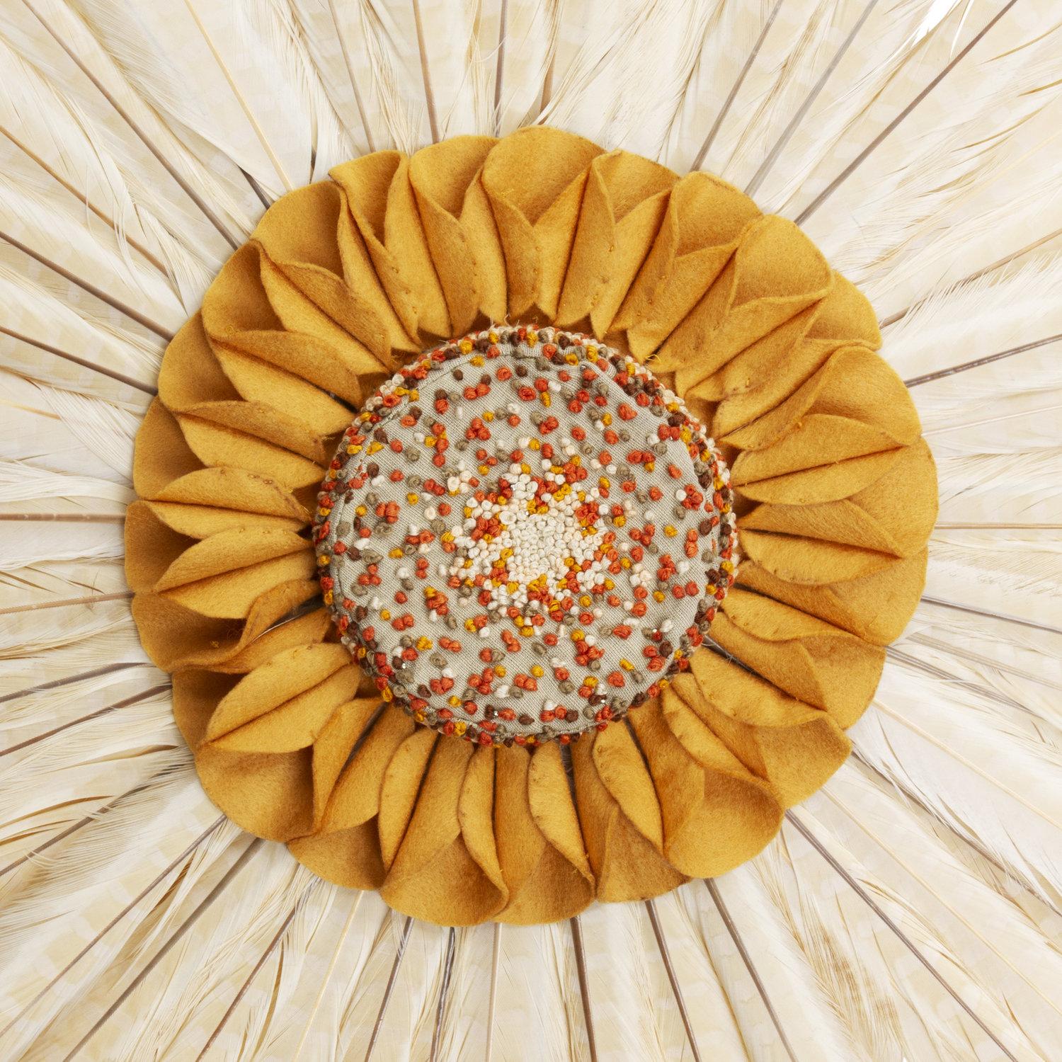 Wall-Mounted White Feathers Composition composed of a combination of Colchis pheasant feathers minutely, the core is made from hand-embroidered linen fabric using the knot technique, surrounded by a conical felt, assembled in a circle and delivering