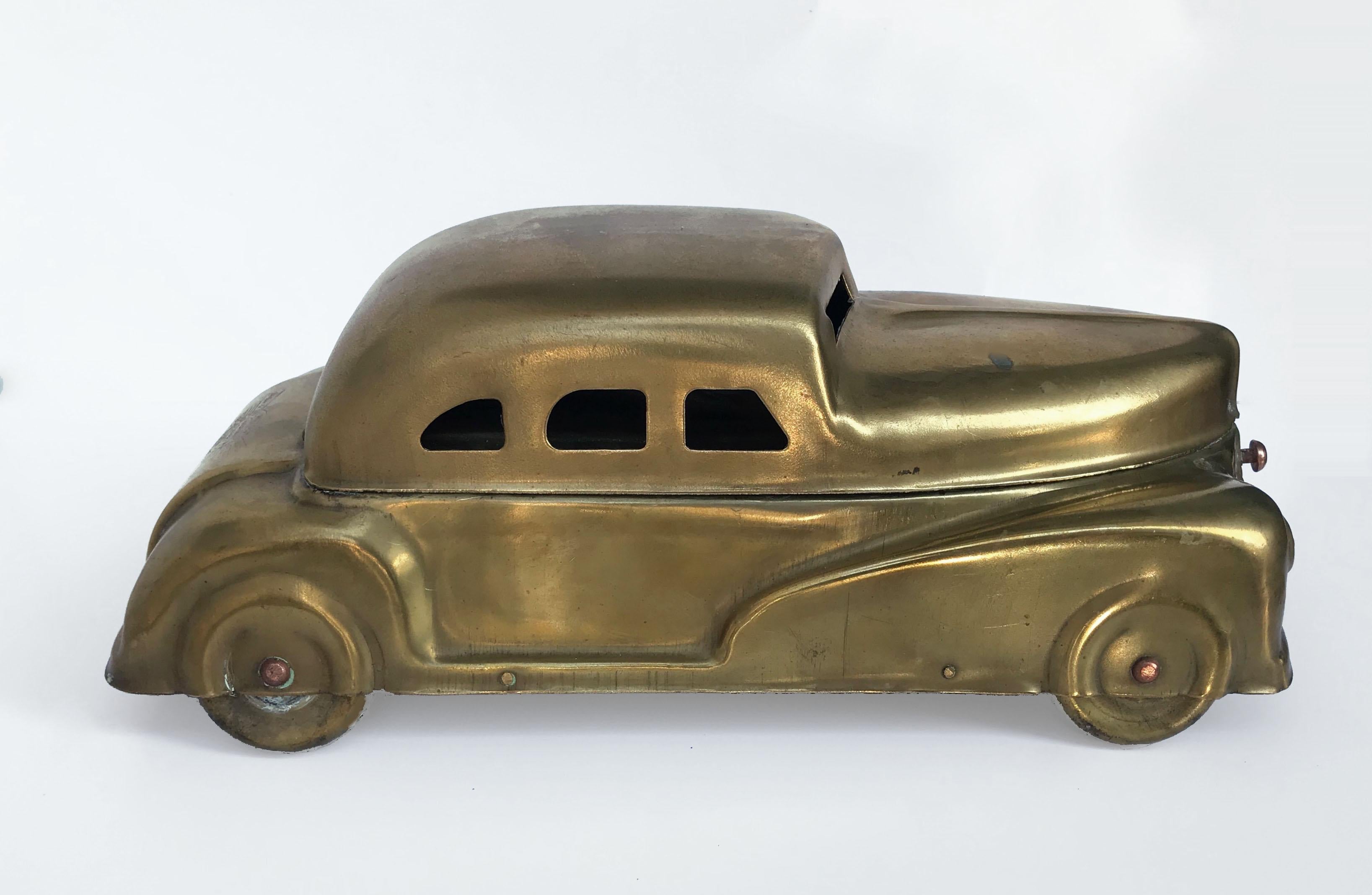 Patent 75086 - This is a large tobacco box with many purposes, (Child's Paint Set). Car in multicolored golden tin in classic brass. Almost new with all the original parts. Wonderfully designed with slimming classic art deco. There are many uses for