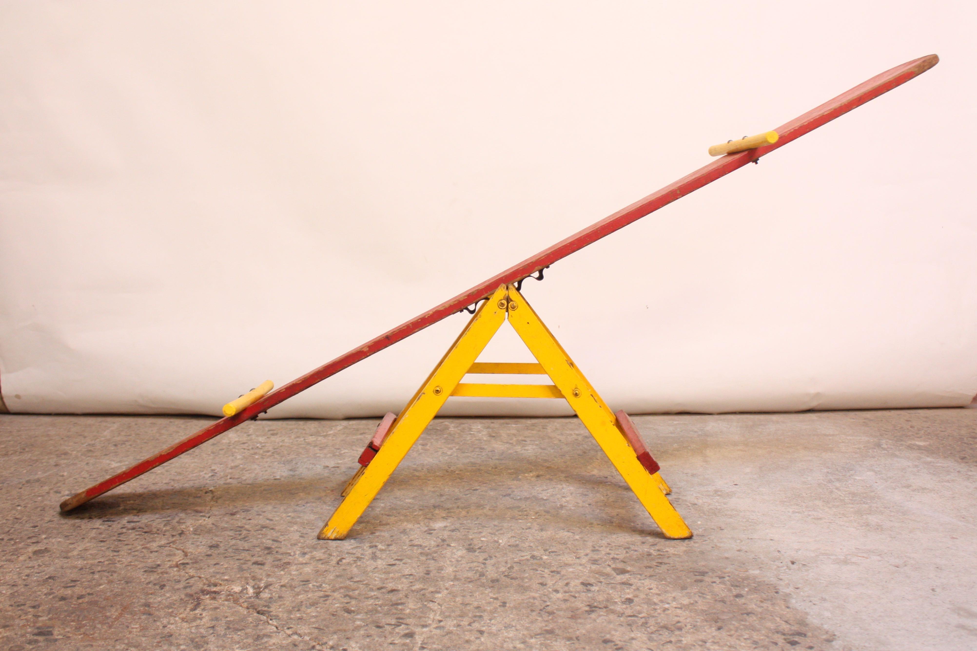 how to make a seesaw with popsicle sticks