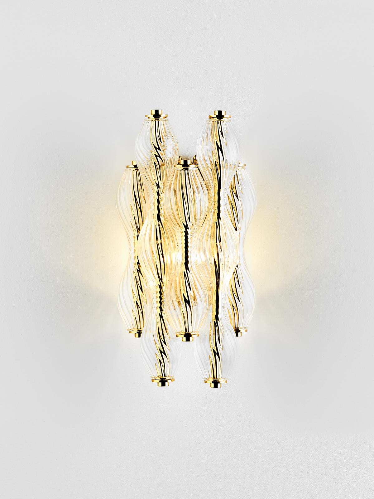 And Objects, product design studio founded by Martin Brudnizki and Nick Jeanes based in London.

Crafted from hand blown, twisted glass, the Wherwell Wall Light is suspended from a traditional solid brass mount, made-up of individual spiralled glass