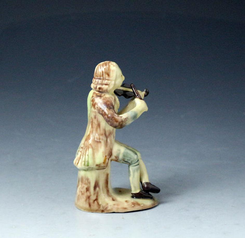 Whieldon-Astbury Pottery Figure of a Violinist Staffordshire, Mid-18th Century In Good Condition In Woodstock, OXFORDSHIRE