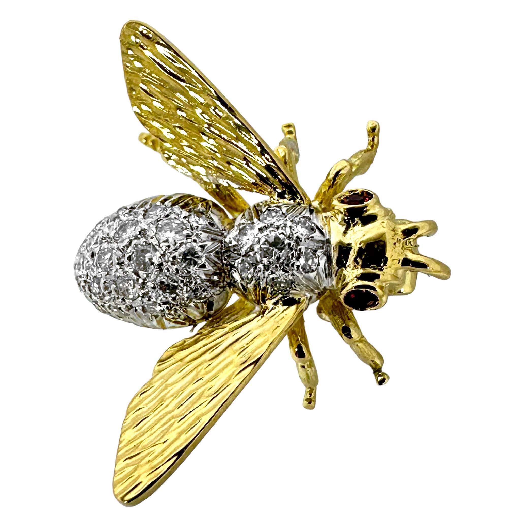 This fanciful Mid-20th Century Italian creation depicts a beautifully proportioned honey bee with wings spread, ready for flight. The thorax and abdomen are heavily diamond encrusted, and eyes are sultry antique cut natural rubies. Total approximate
