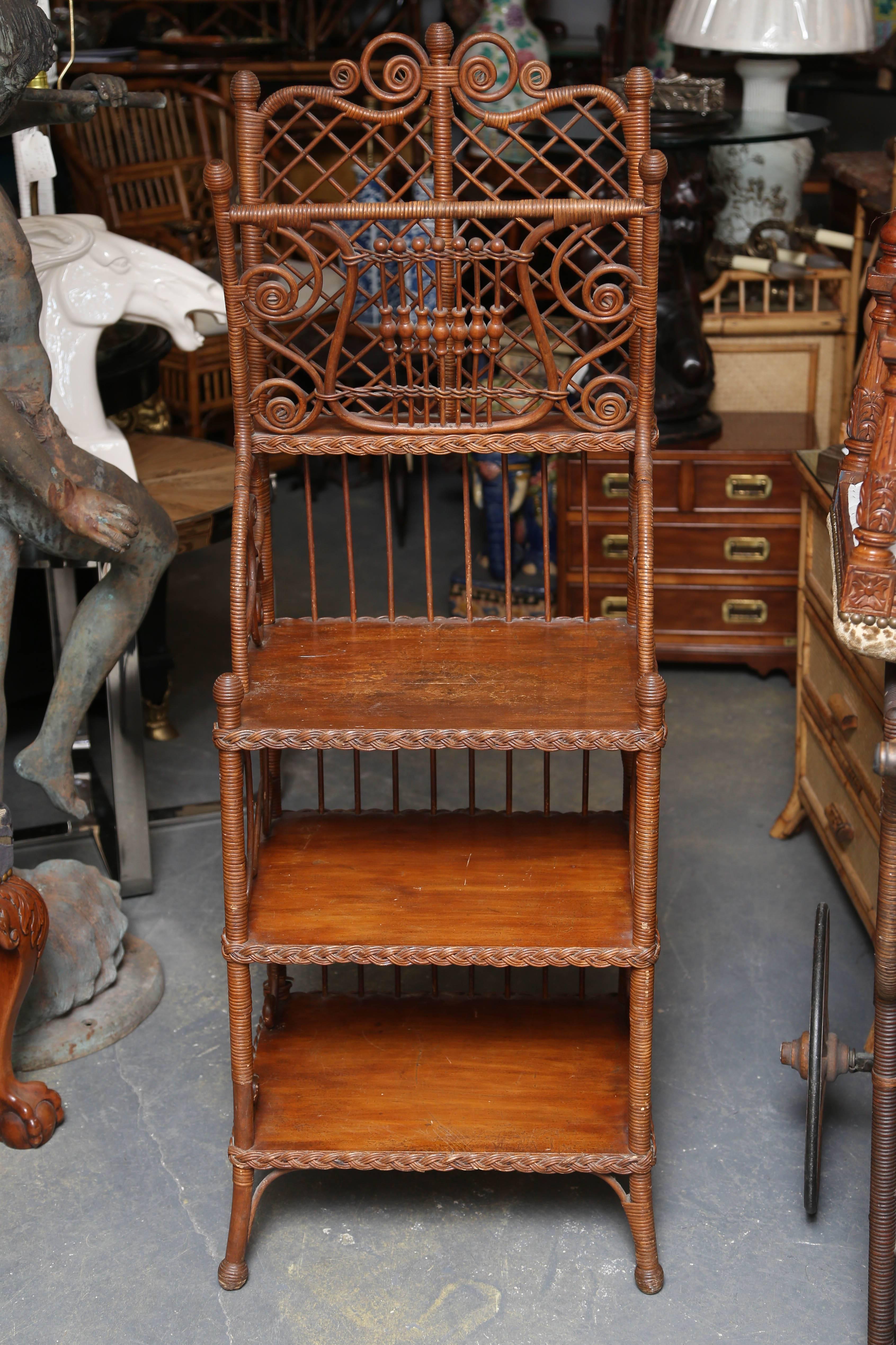 Possibly Heywood-Wakefield with superior elaborate design and workmanship. 
The finish is original and natural.