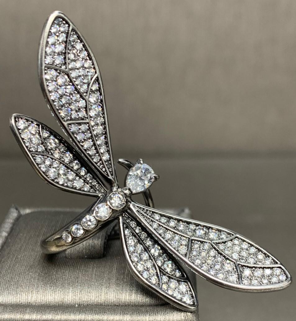 Pear Shape & White Diamond, White Gold Dragonfly Ring. 

Featuring a Pear Shape & White Diamond Dragonfly Ring with a total weight of 2.44 carats, set in 18K White Gold with Black and White Rhodium.

This one-of-a-kind ring was created by hand and