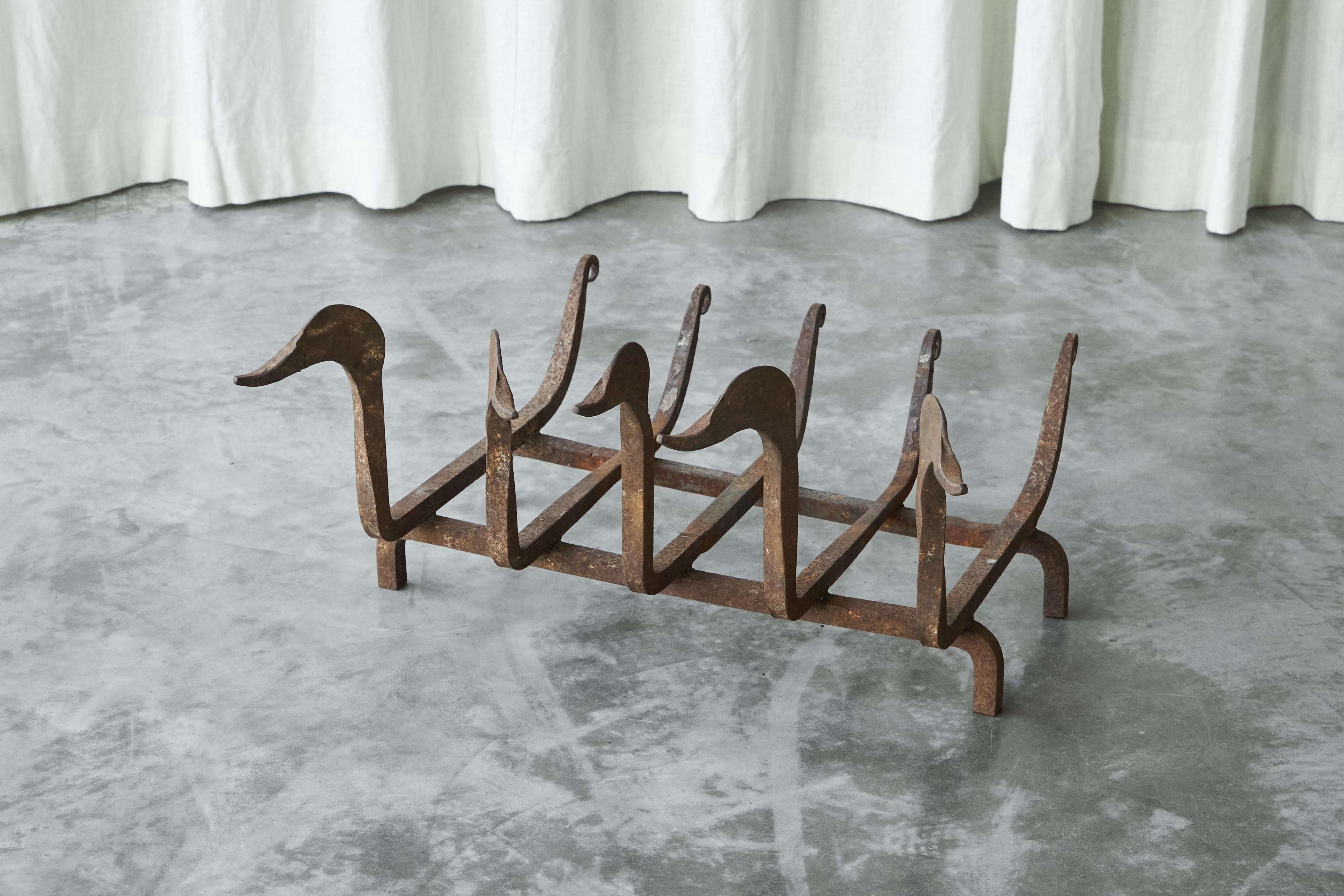 Whimsical Antique Duck Shaped Fire Grate / Andirons in Rusted Wrought Iron, early 20th century.

A very special and whimsical antique duck shaped fire grate / andirons in rusted wrought iron, made by a skilled craftsman in the late 19th century /
