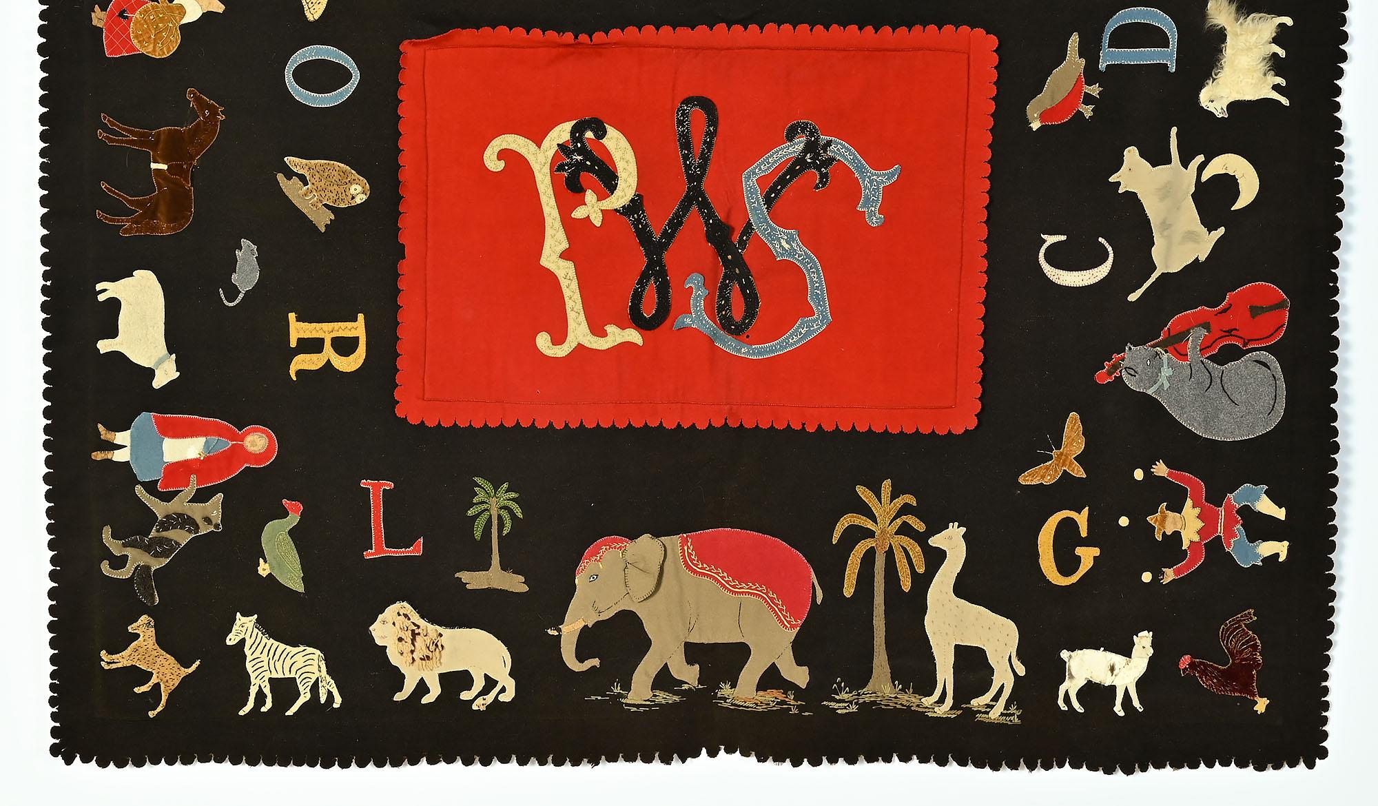 This appliqued table mat may have been made for a child but it can certainly please any adult. Next to each letter is an animal or vignette whose first letter is shown next to it. For instance, next to the letter C is the cow jumping over the moon.