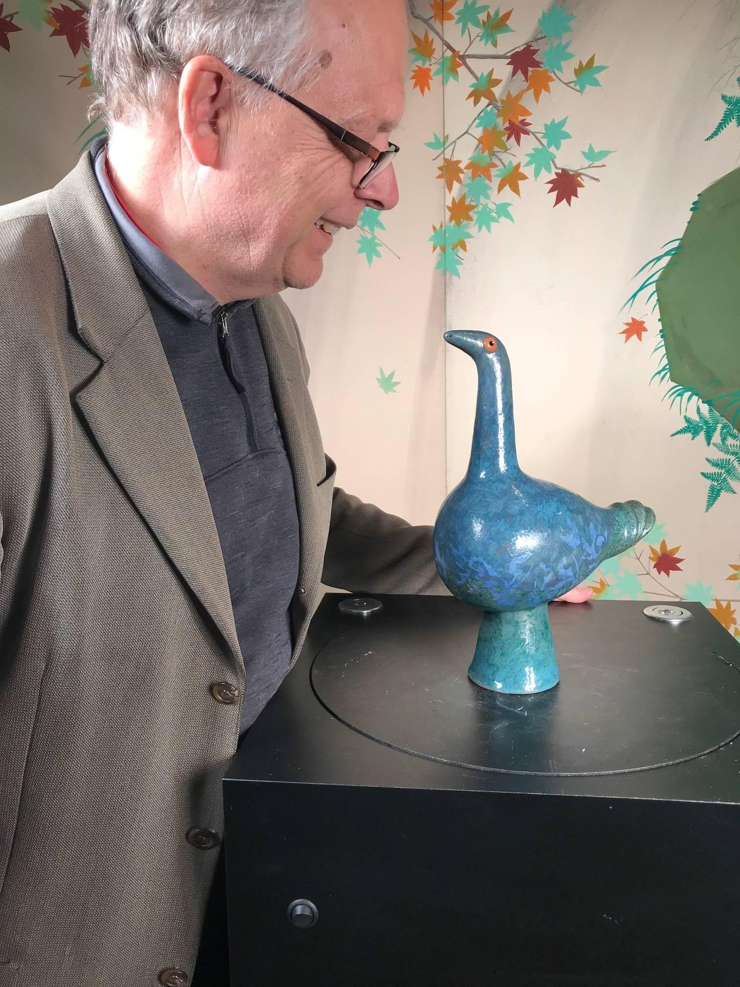 A whimsical blue bird sculpture master work designed and hand-painted by Eva Fritz-Lindner, (1933-2017)

This is a creative handmade, hand-painted and hand glazed blue glazed bird. It was designed and hand-painted by the now deceased master
