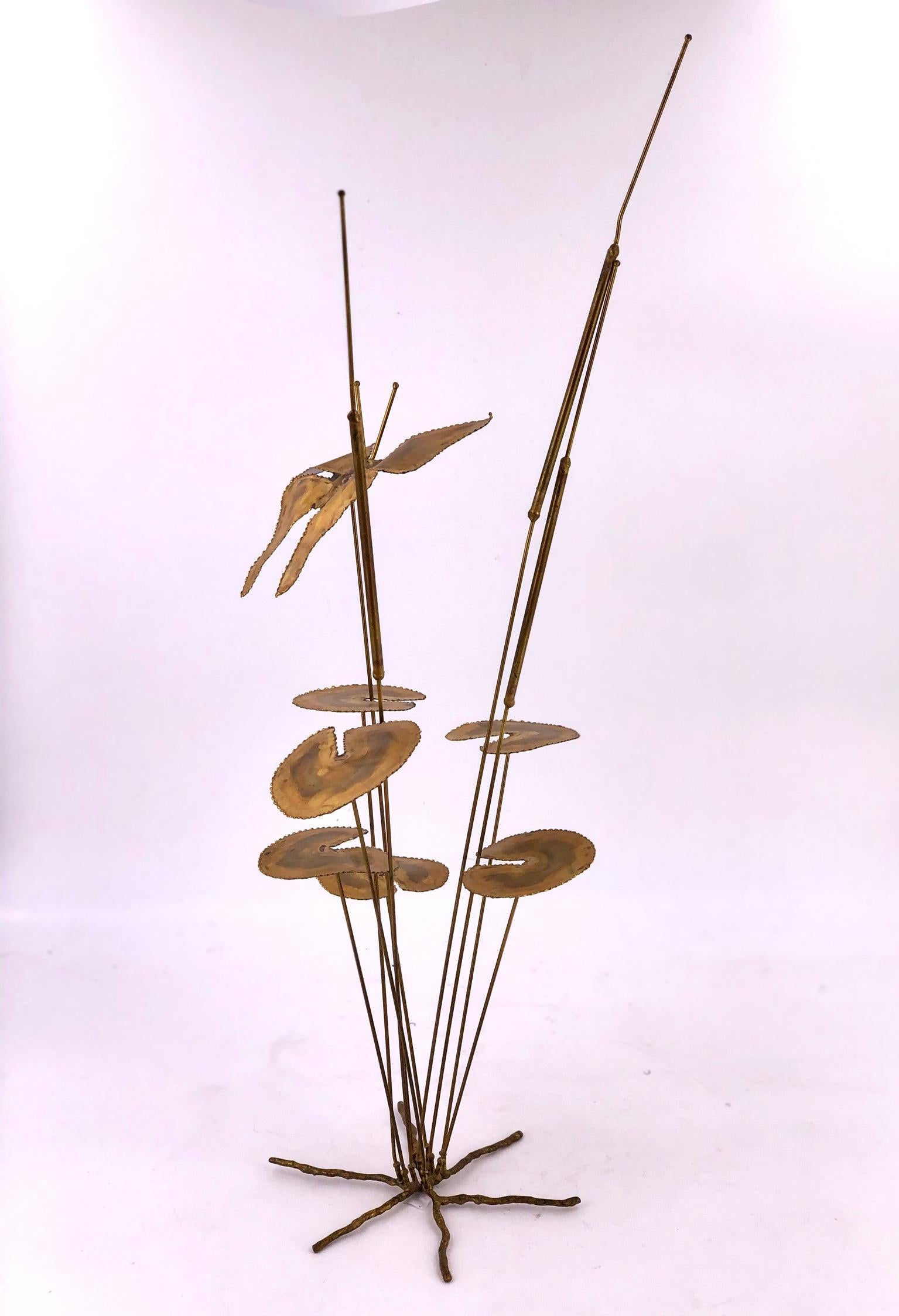 Simple and beautiful welded brass sculpture of a butterfly flying over flowers. unsigned circa 1970s well-done piece signed by D.S Hillet we cant figure the signature.