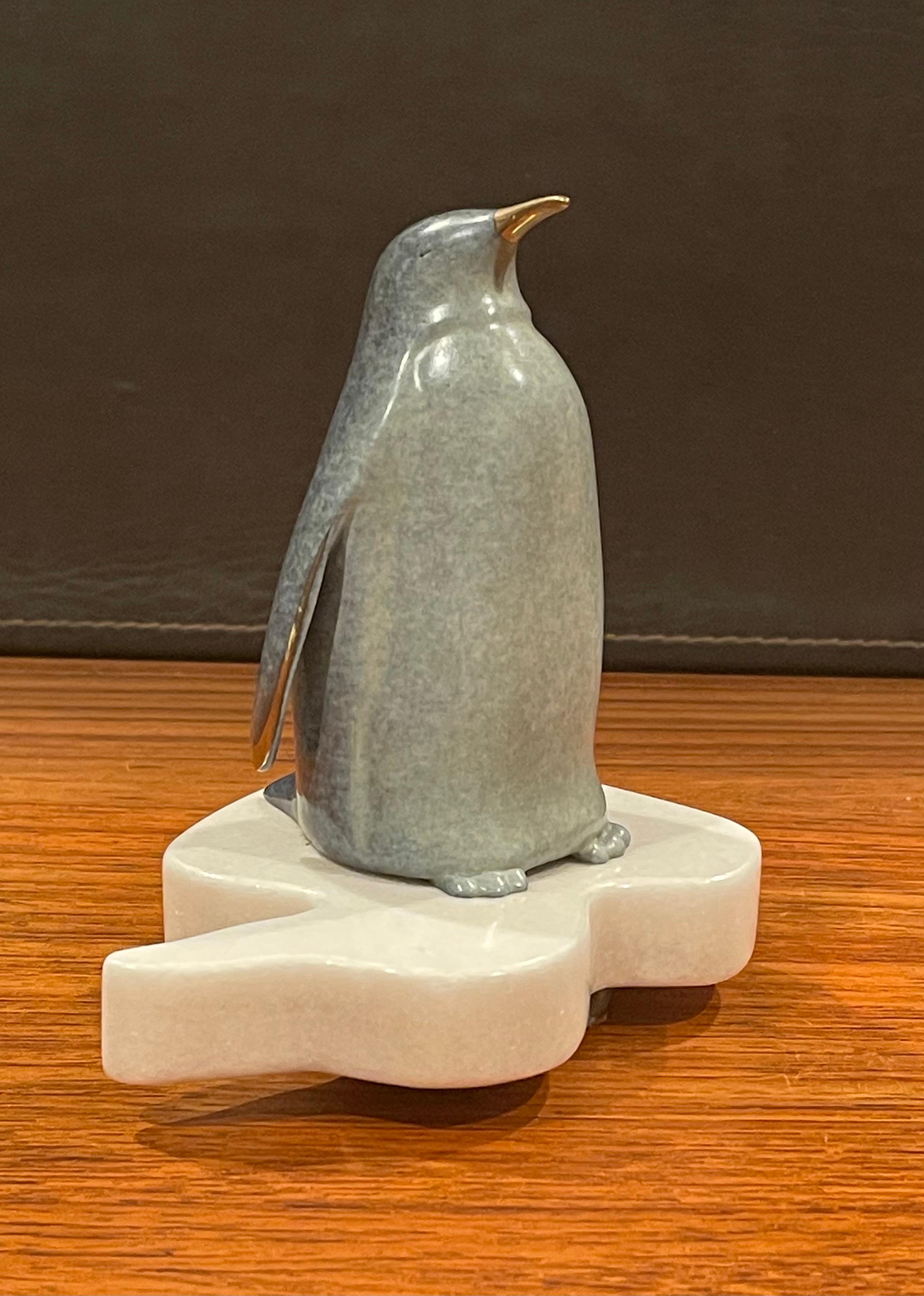 American Whimsical Bronze Penguin Sculpture on Rotating Marble Base by Scott Hanson