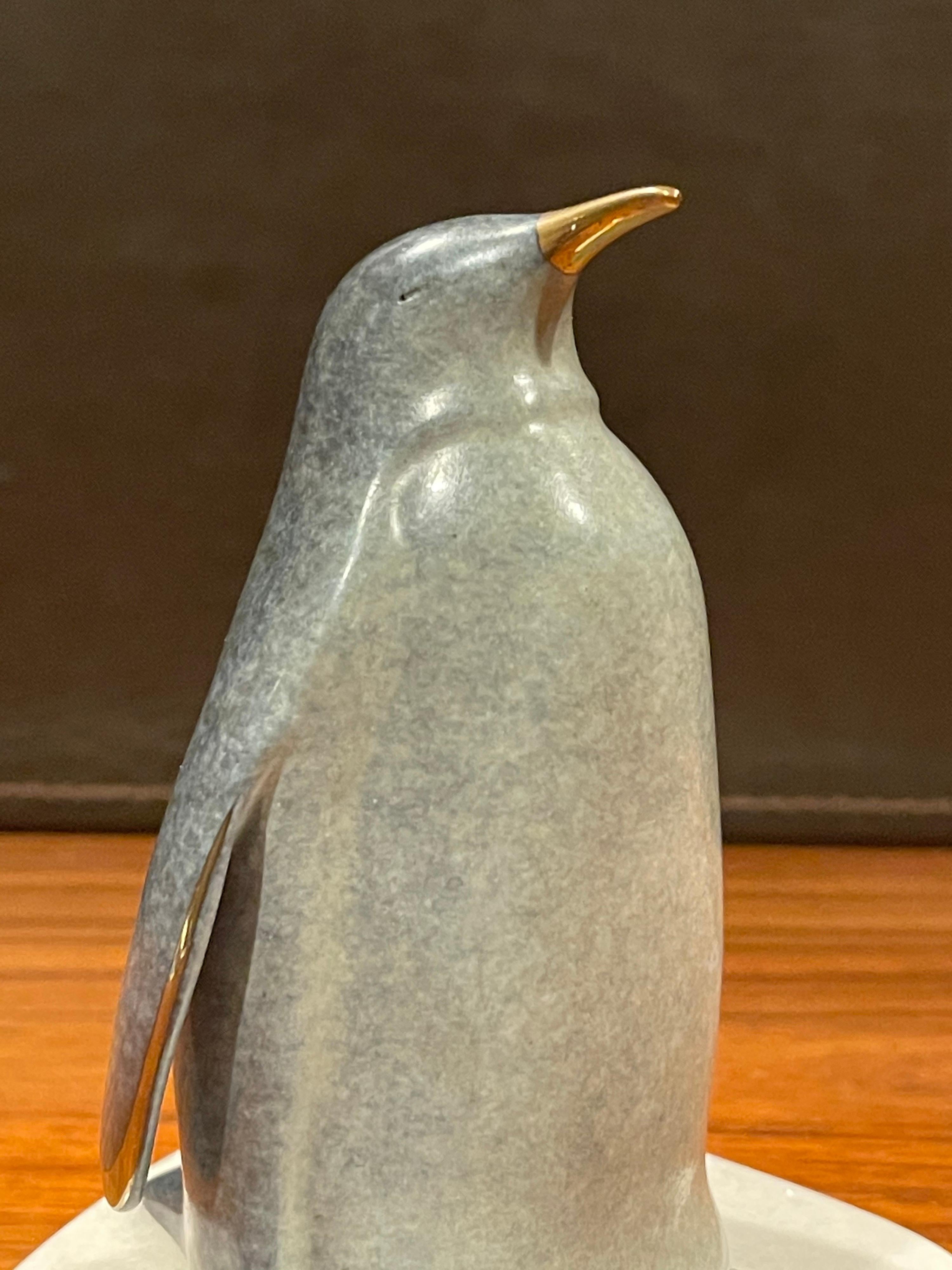 Whimsical Bronze Penguin Sculpture on Rotating Marble Base by Scott Hanson In Good Condition In San Diego, CA
