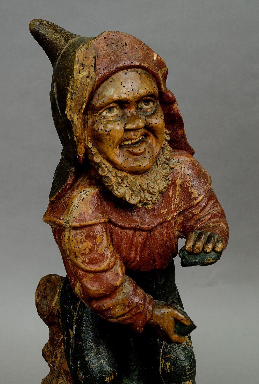 Whimsical Carving of a Dwarf with Snuffbox, 19th Century

A 19th century funny carved and painted dwarf with snuffbox. Unrestored original condition, old wormholes, partly paintloss and damages.
Measures:
Height 20.87