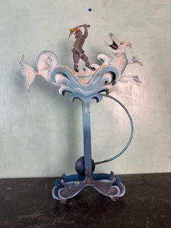 Whimsical Cast Iron kinetic Figural Folk Art Toy with Knight and Dragon Motif