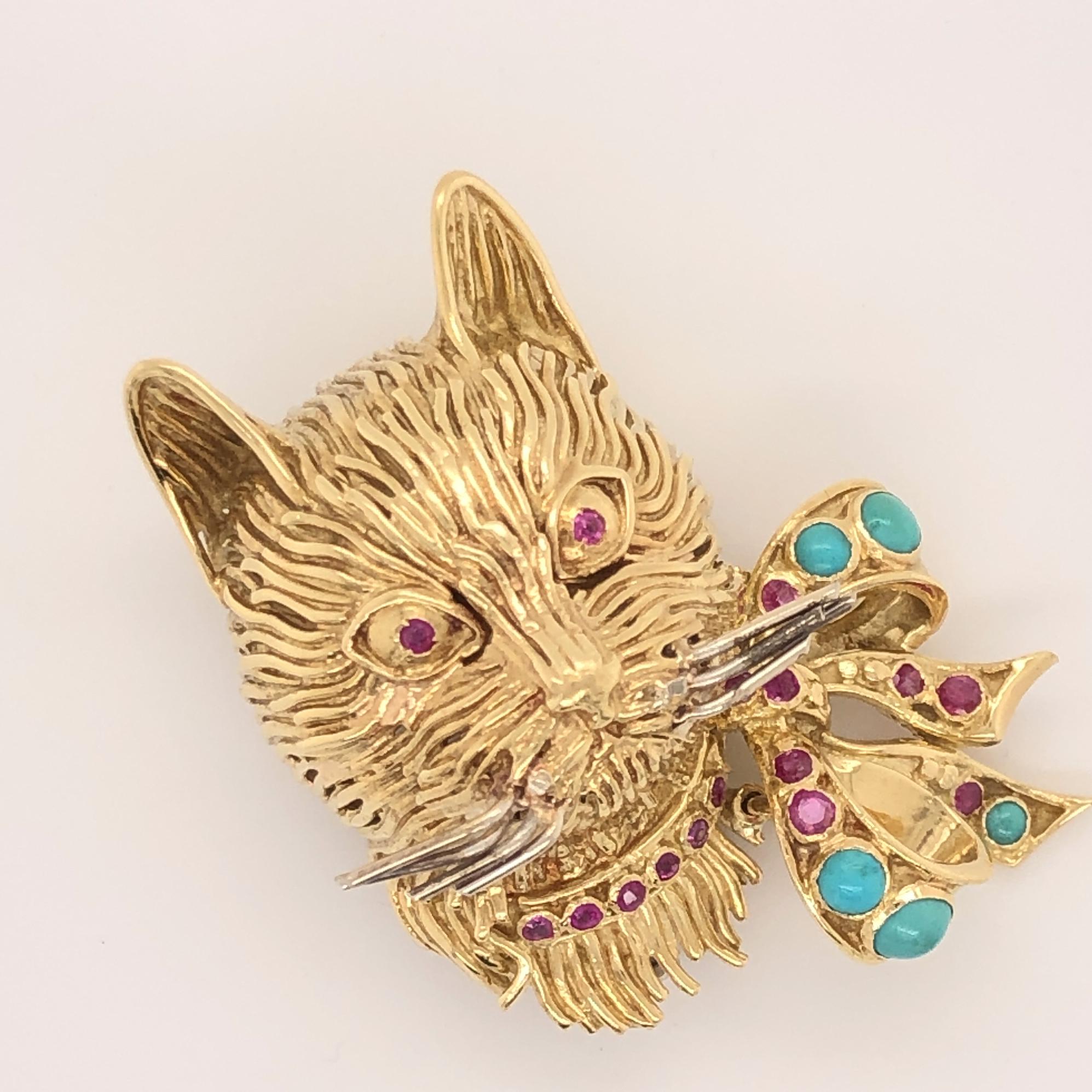 Perfect for the cat lover or someone who loves animal pins.  
This figural three dimensional cat was made in Italy by Garavelli.  The 18k gold work is exquisite it looks like you can reach out and pet the fur.  The cat has ruby eyes and a ruby
