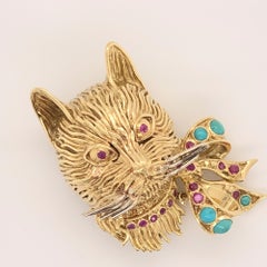 Whimsical Cat Head with Turquoise and Ruby Bow Yellow Gold Brooch by Garavelli