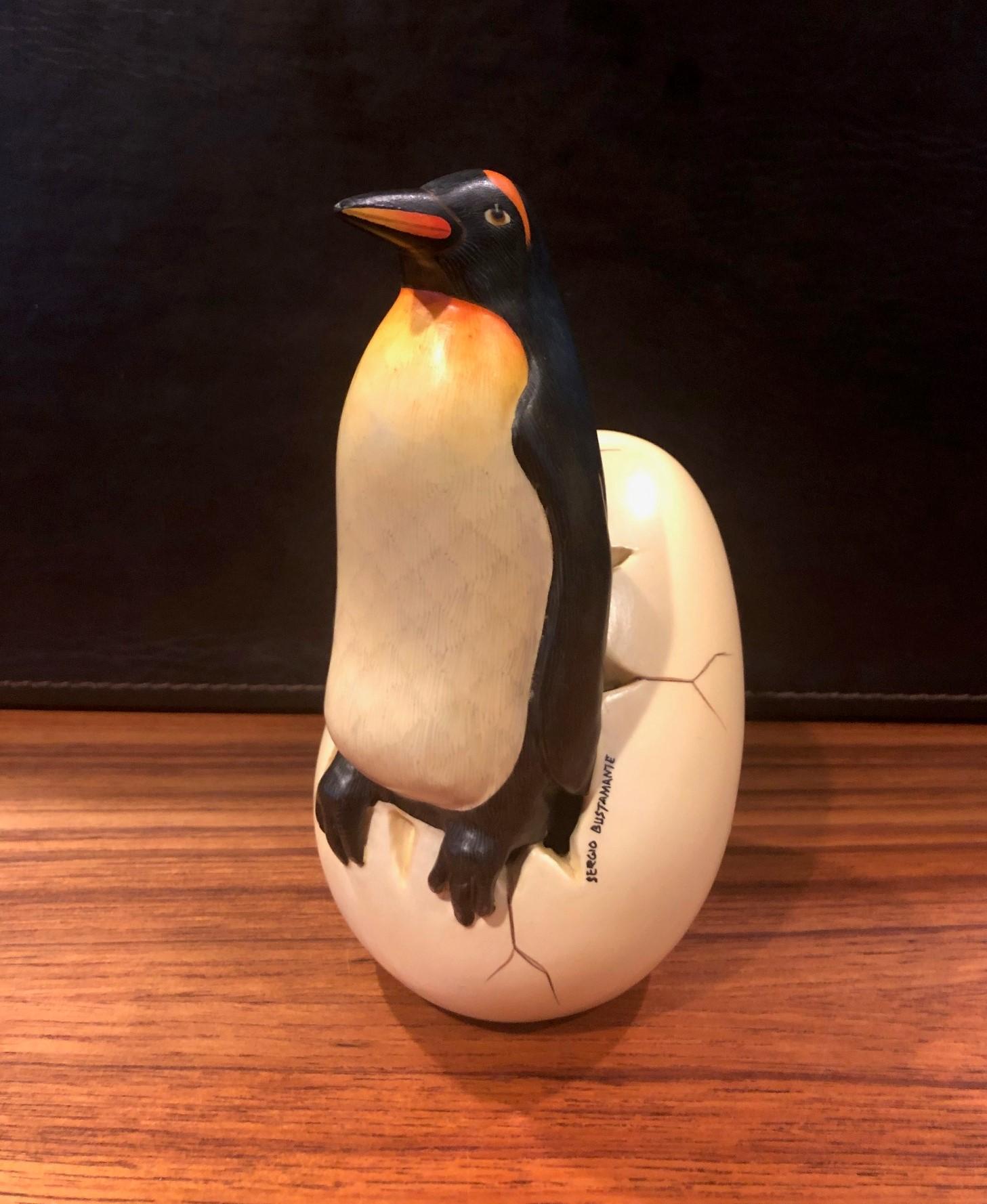 A very cool, unique and whimsical ceramic hatching penguin from egg sculpture signed by Mexican artist, Sergio Bustamante, circa 1970s. The piece was acquired directly form the artist and is beautifully hand painted on ceramic.