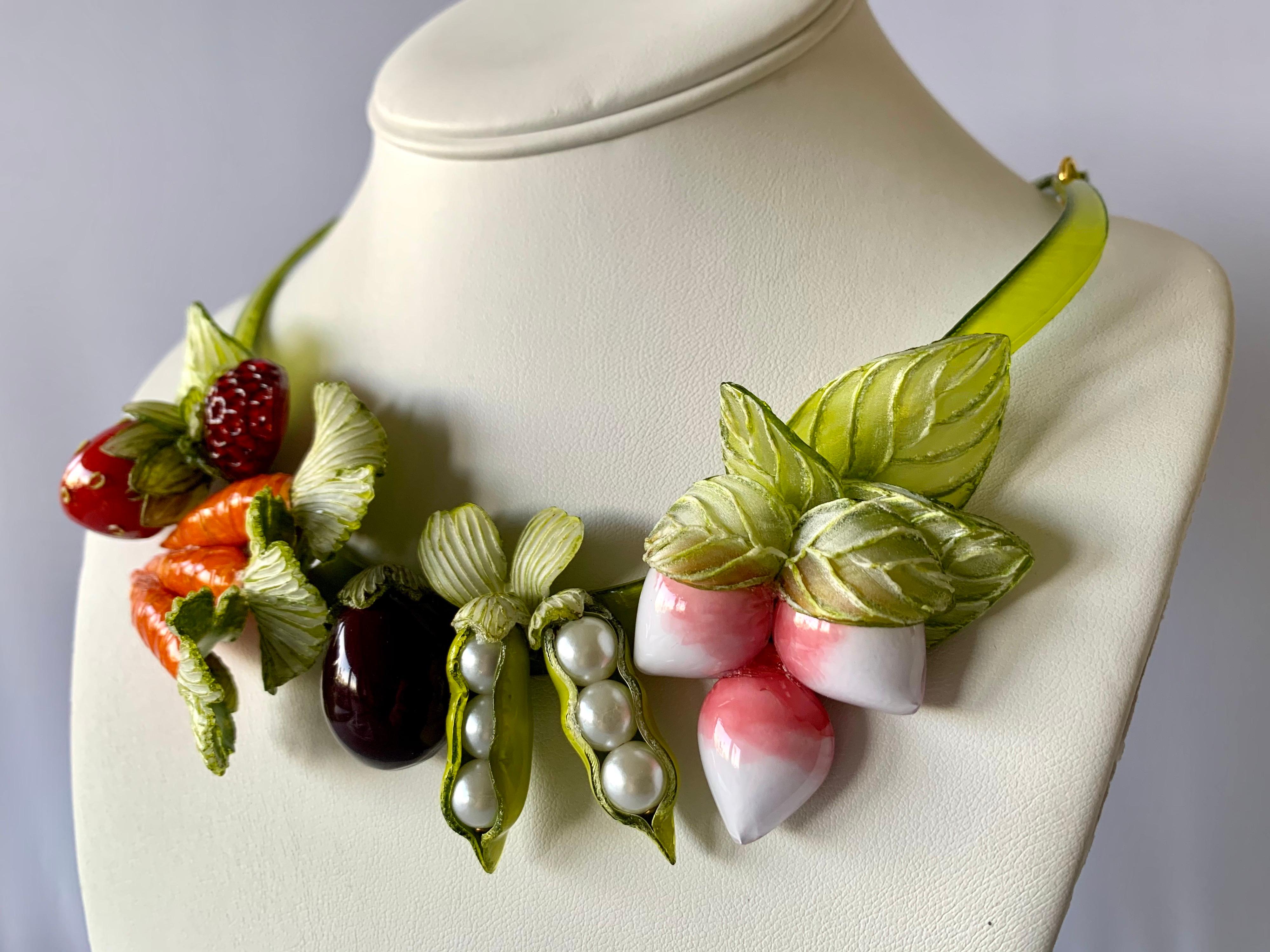 Contemporary designer fruit and vegetable statement necklace by Cilea Paris - the bold necklace is comprised out of a row of highly adorned enameline (resin and enamel) featuring a plethora of fruits and vegetables. Lightweight and easy to wear,