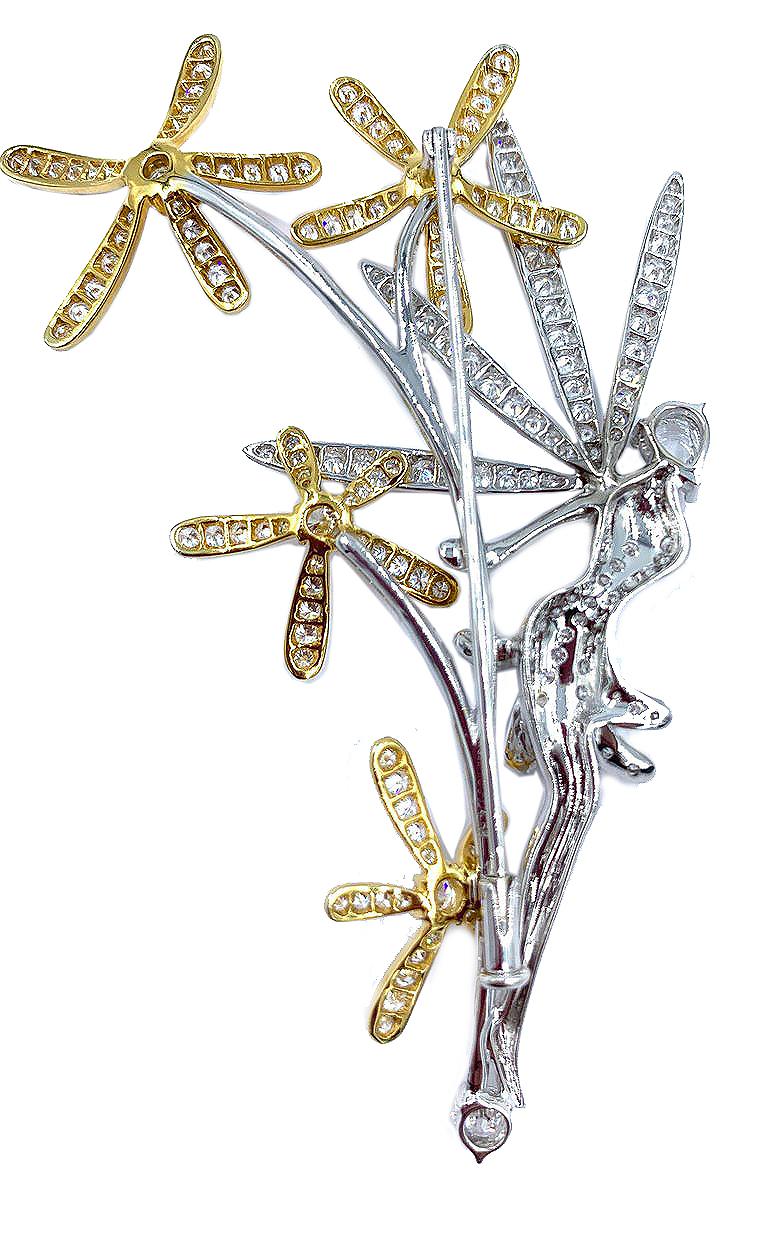 A magical and whimsical fairy brooch set with almost 5 carats of diamonds in 18 karat white and yellow gold.  Everyone will complement this stunning and elegant brooch!