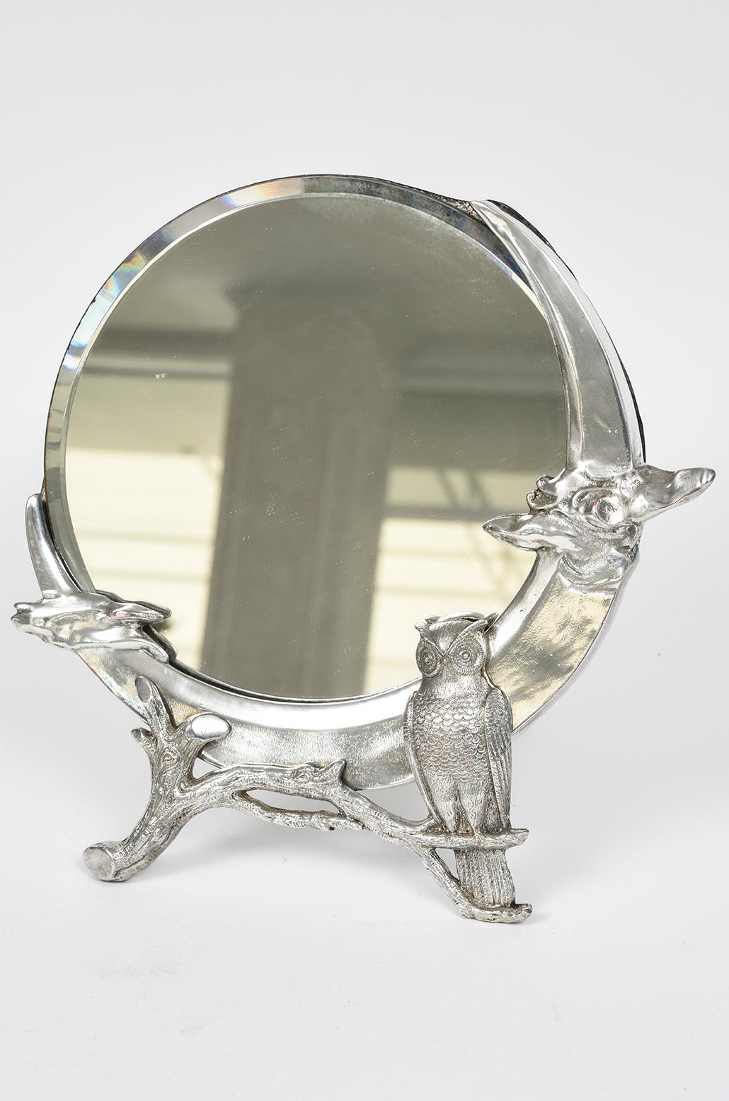 Beautiful dresser mirror with the original bevel glass mirror set into a figural three dimensional owl on a branch along with a cloud on either side.  Measurement is 1 1/8