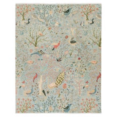 Caprichosa alfombra de lana india moderna Garden Paradise - Motivo de pájaro azul y coral suave