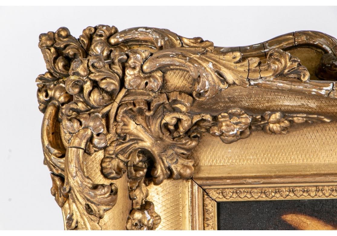 An Antique portrait of a tan and brown terrier mix wearing its collar with ring. Mounted in a deep elaborately carved baroque style gilt frame.
Measures: Painting 9 x 9