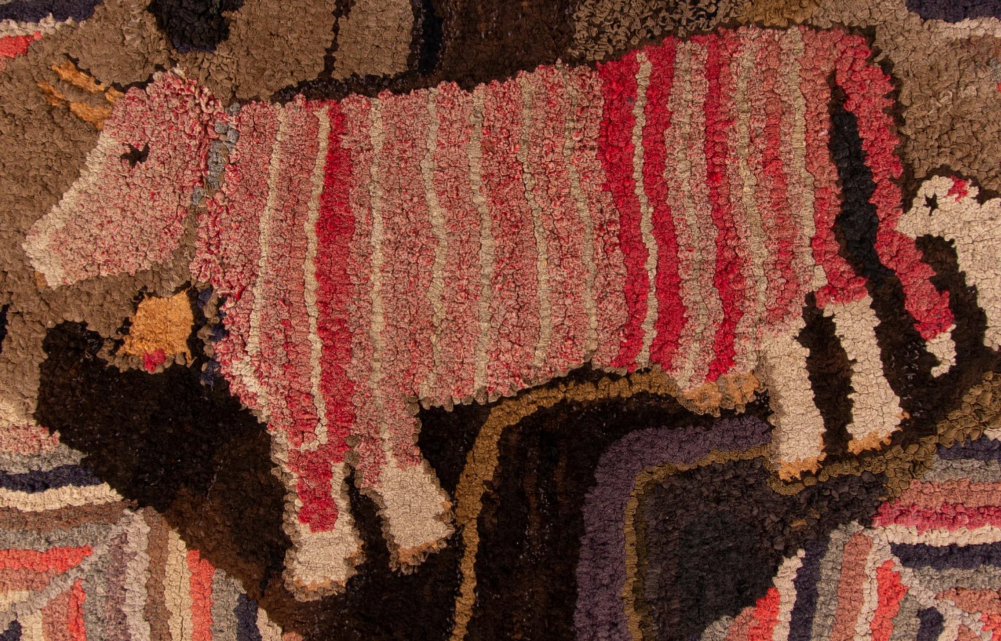 Whimsical Hooked rug with a pink striped cow and a little white dog, ca 1885-1910

Hooked rug with a pink striped cow, wearing a large cowbell, followed by a small white dog. With excellent folk style, these are canted at a downward angle within a