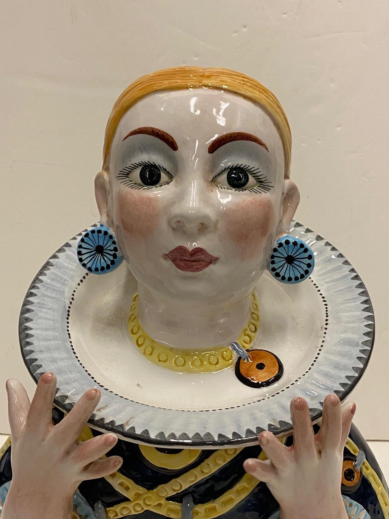Very unusual fun glazed Italian bust of a woman hand painted in vibrant colors.
Says made in Italy, with artist's initials on the bottom.