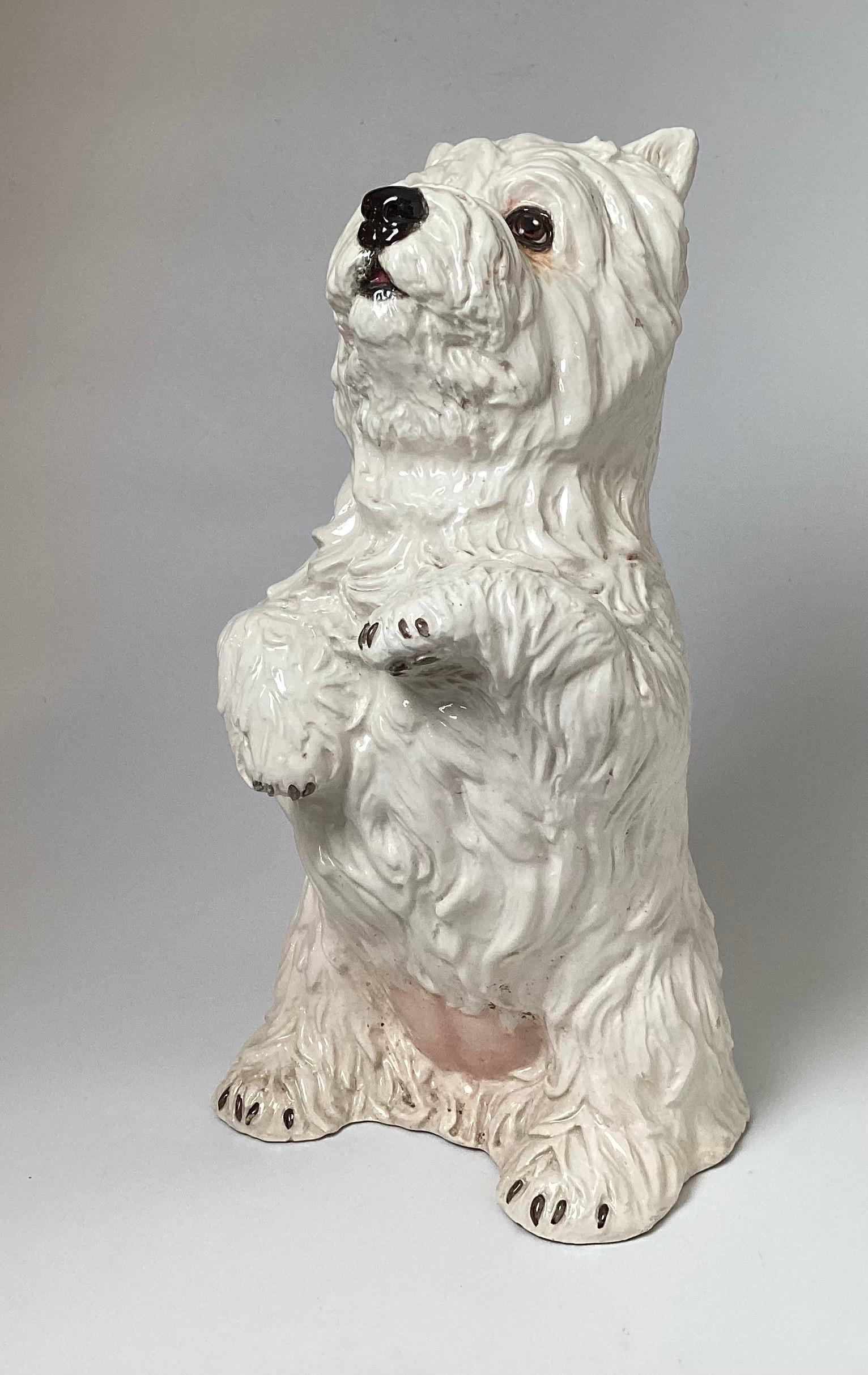 A charming Italian Hand Painted ceramic figure of a West Highland White Terrier. Almost life-Size, perfect for a westie lover, circa 1960s, 17.5 inches tall in excellent condition.
