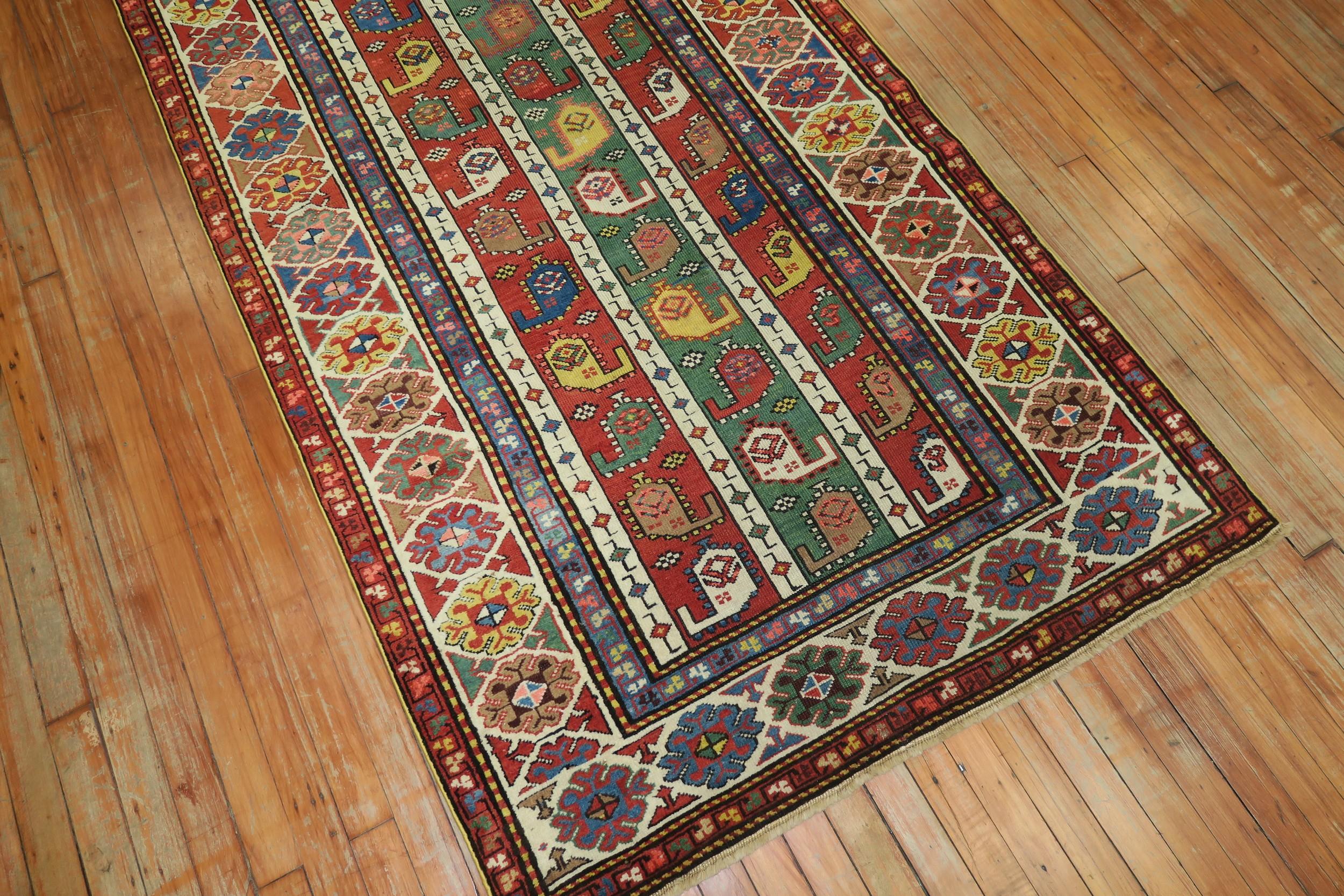 A geometric looking Caucasian Kazak runner in tomato red, green dominant accents. The colors are lively, the design is unique. A connoseuirs dream.

Measures: 3'10” x 8'2”.

 