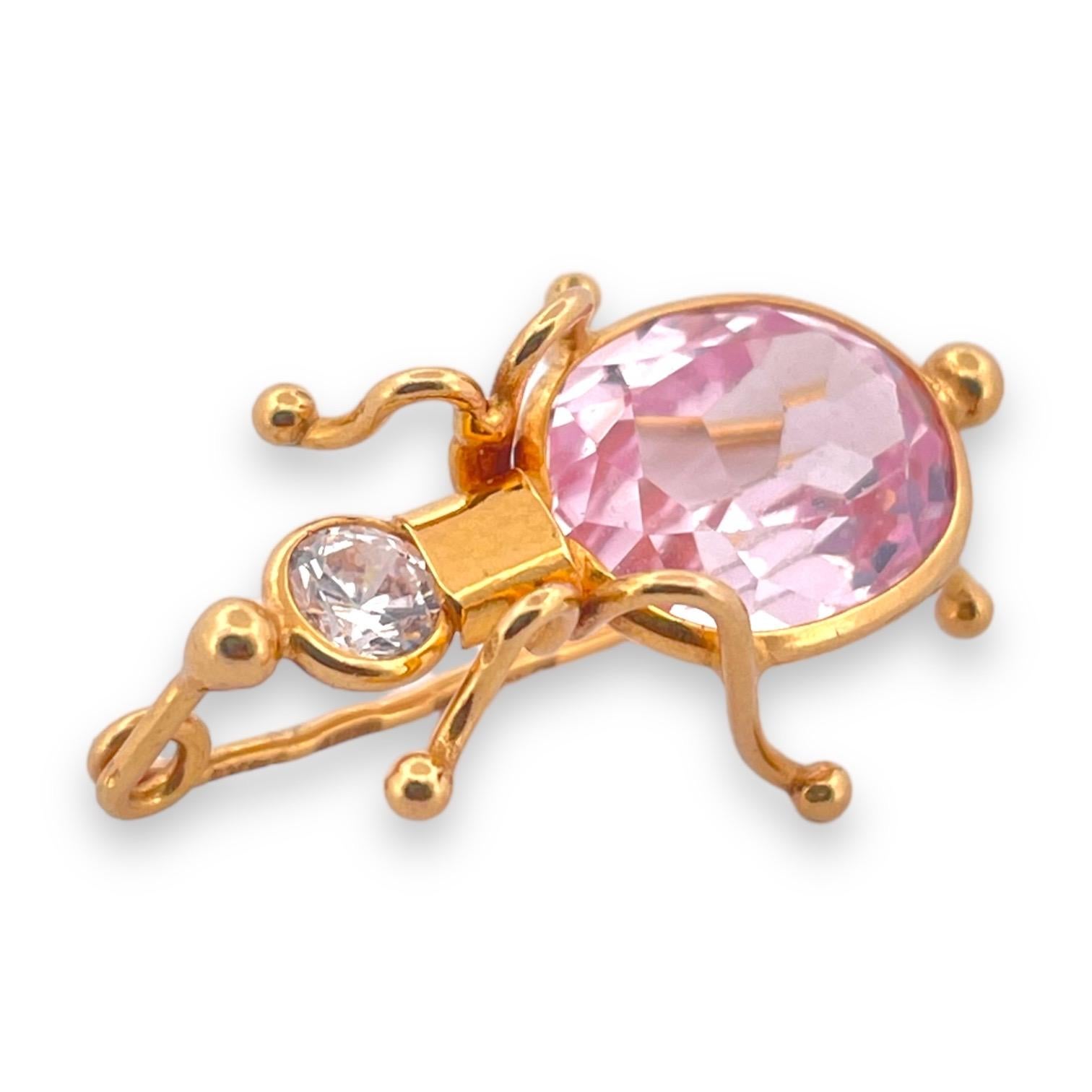 Experience the playful charm of our Whimsical Kunzite & White Sapphire Bug Brooch, a true treasure crafted from gleaming 14K yellow gold. This enchanting brooch is adorned with a soft pink kunzite, exuding a gentle sophistication, while the