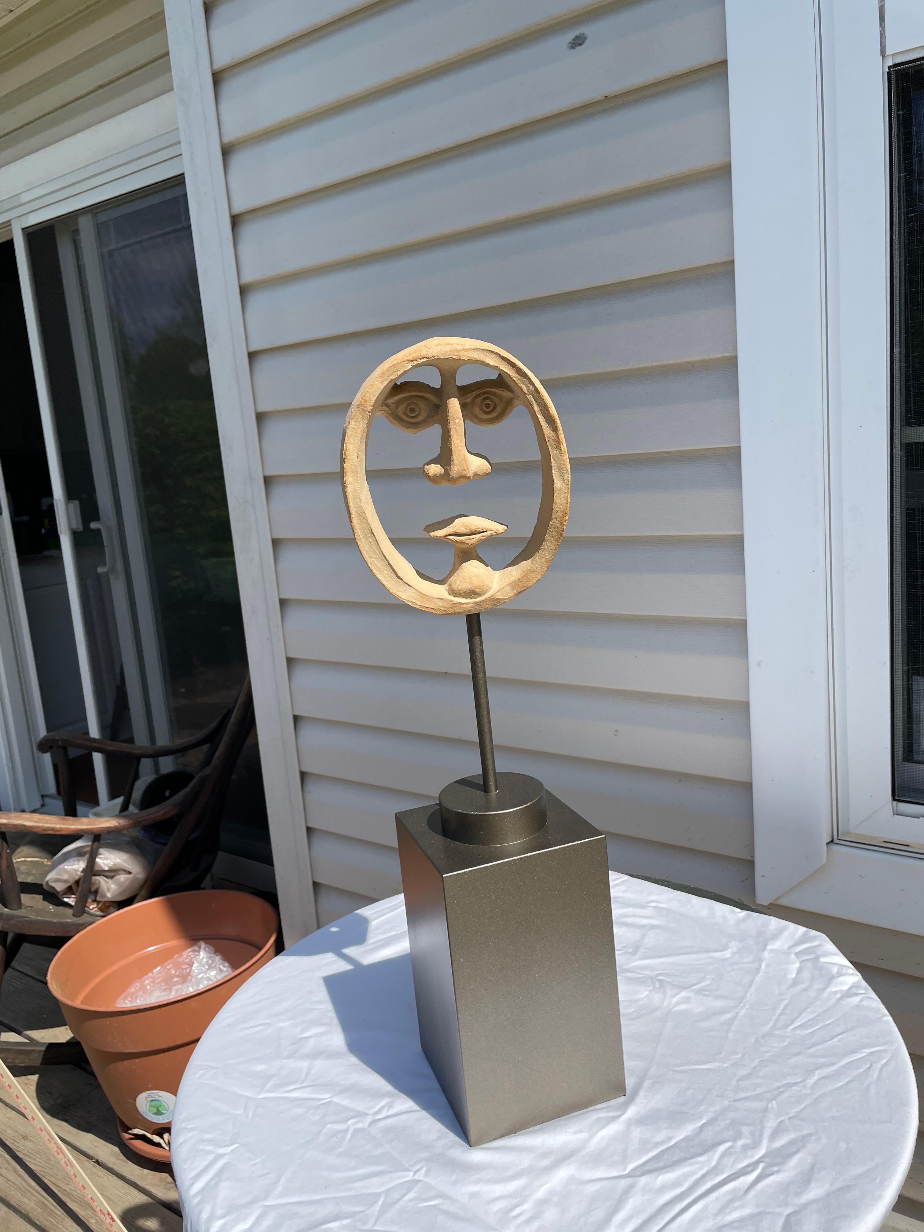 Distinctive David Gil whimsical ceramic face sculpture that conjures “Picasso”, using negative space imaginatively.  Mounted on custom painted wood stand.